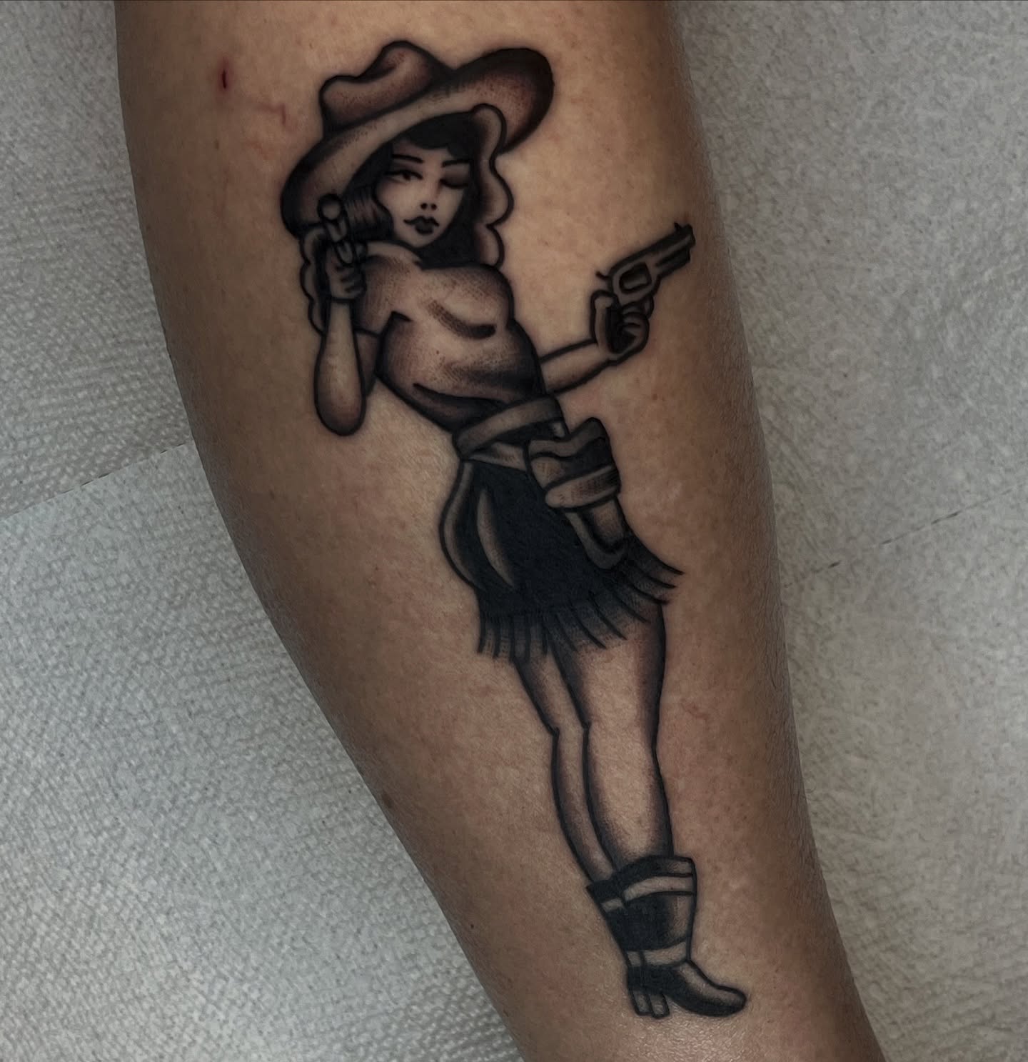 Cowgirl American traditional tattoo on the forearm by August B., Renton, Washington