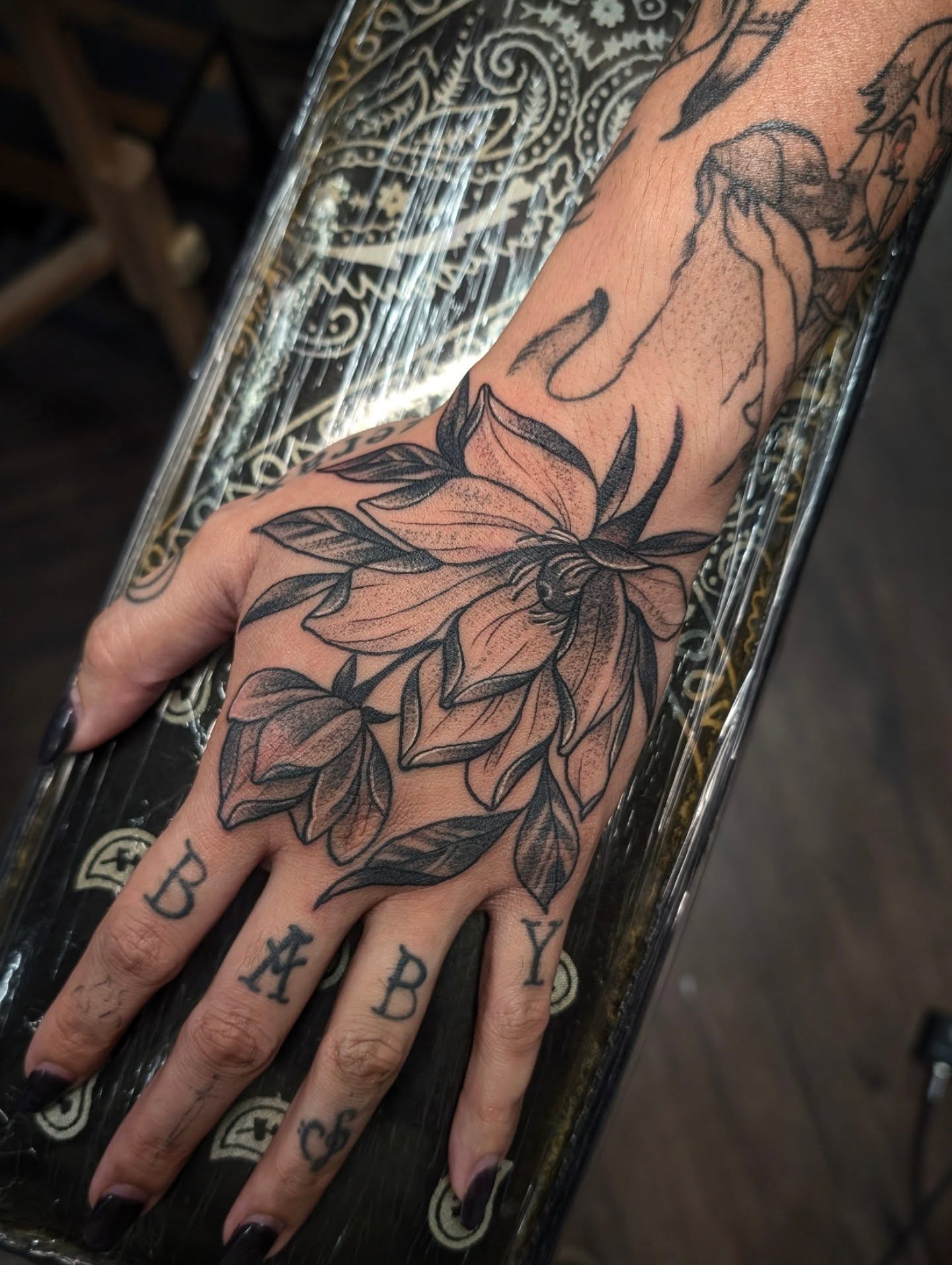 Flower black and grey tattoo on the hand by 𝑹𝒆𝒚𝒎𝒂𝒓𝒄 𝑫𝒂𝒚𝒂𝒖𝒐𝒏