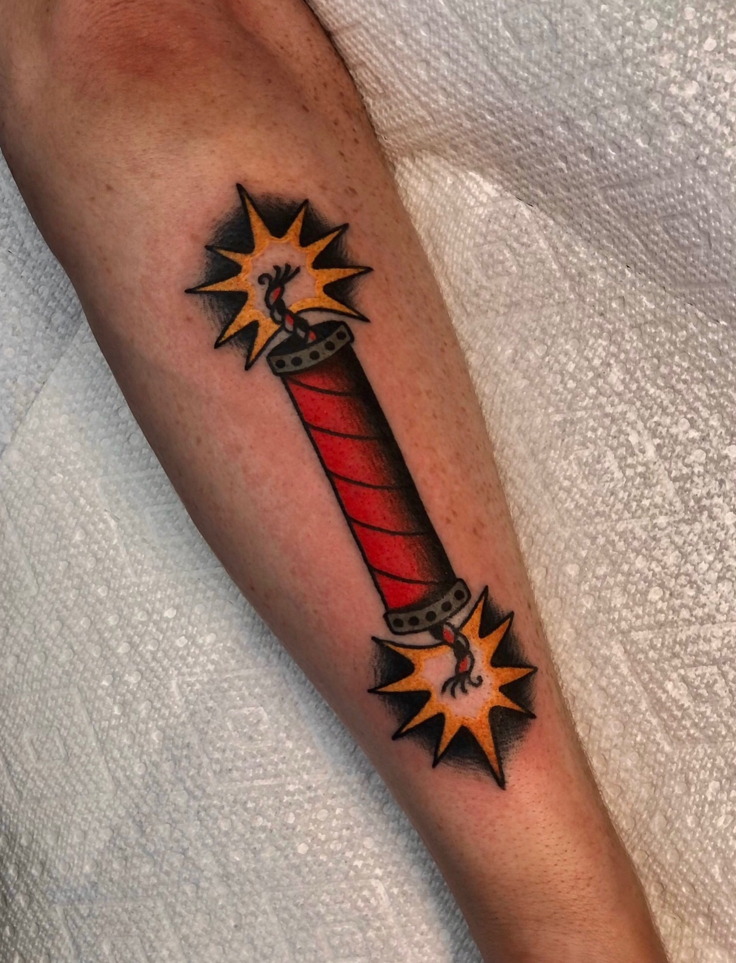 Candy cane American traditional tattoo on the forearm by EVA Traditional Tattoos