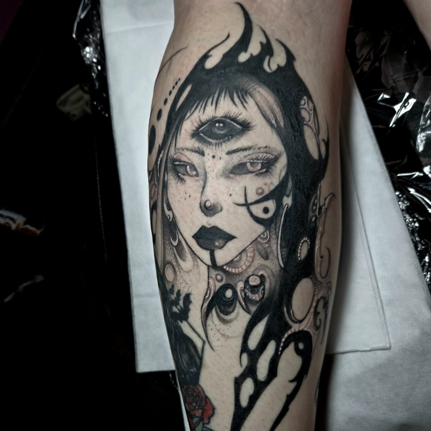 Woman with flame hair dark realism tattoo on the forearm by Ema Fish