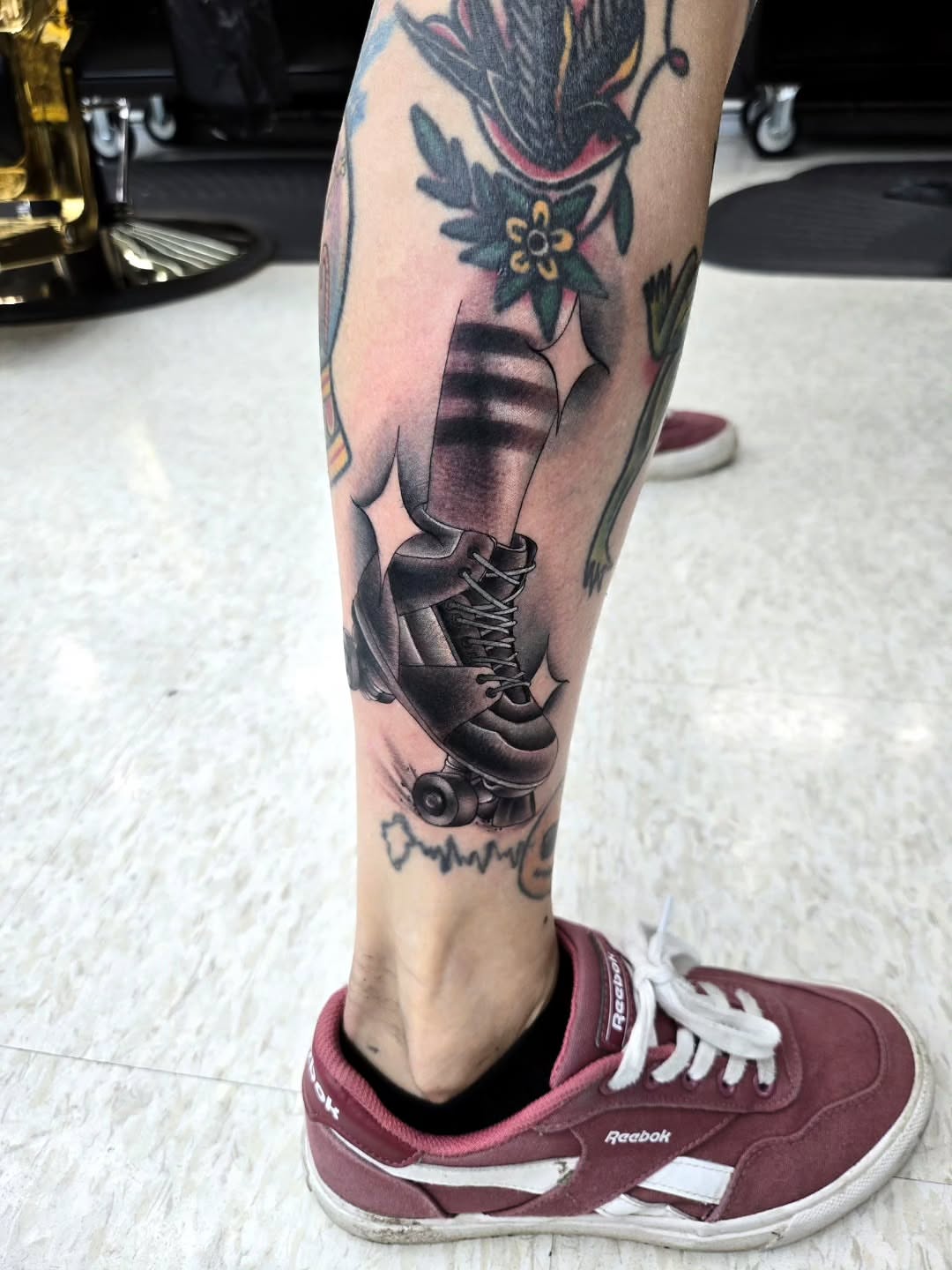 Roller skate realism tattoo on the calf by Jake Lee