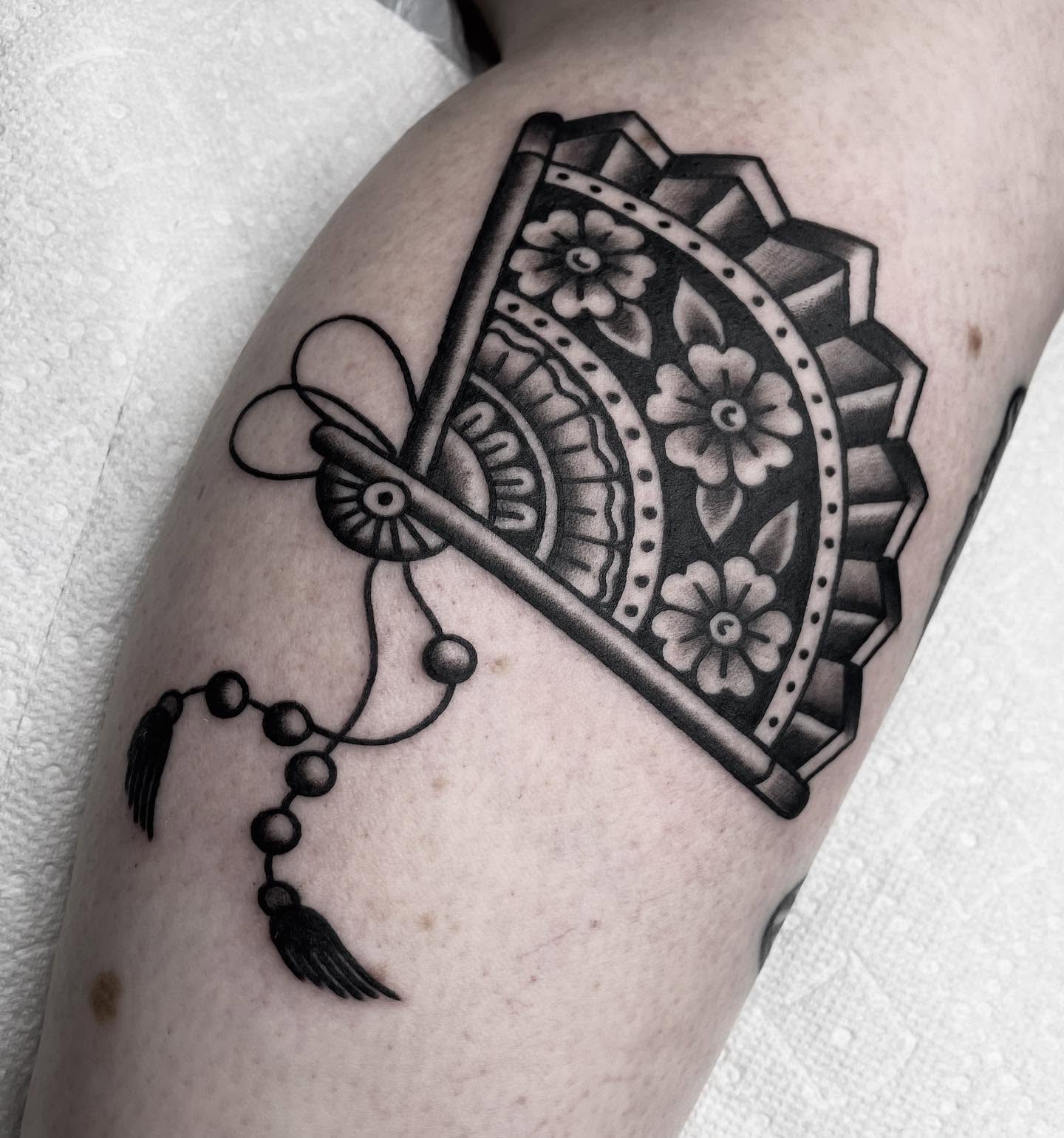 Mandala fan black and grey tattoo on the forearm by Kat, Sacramento, California
