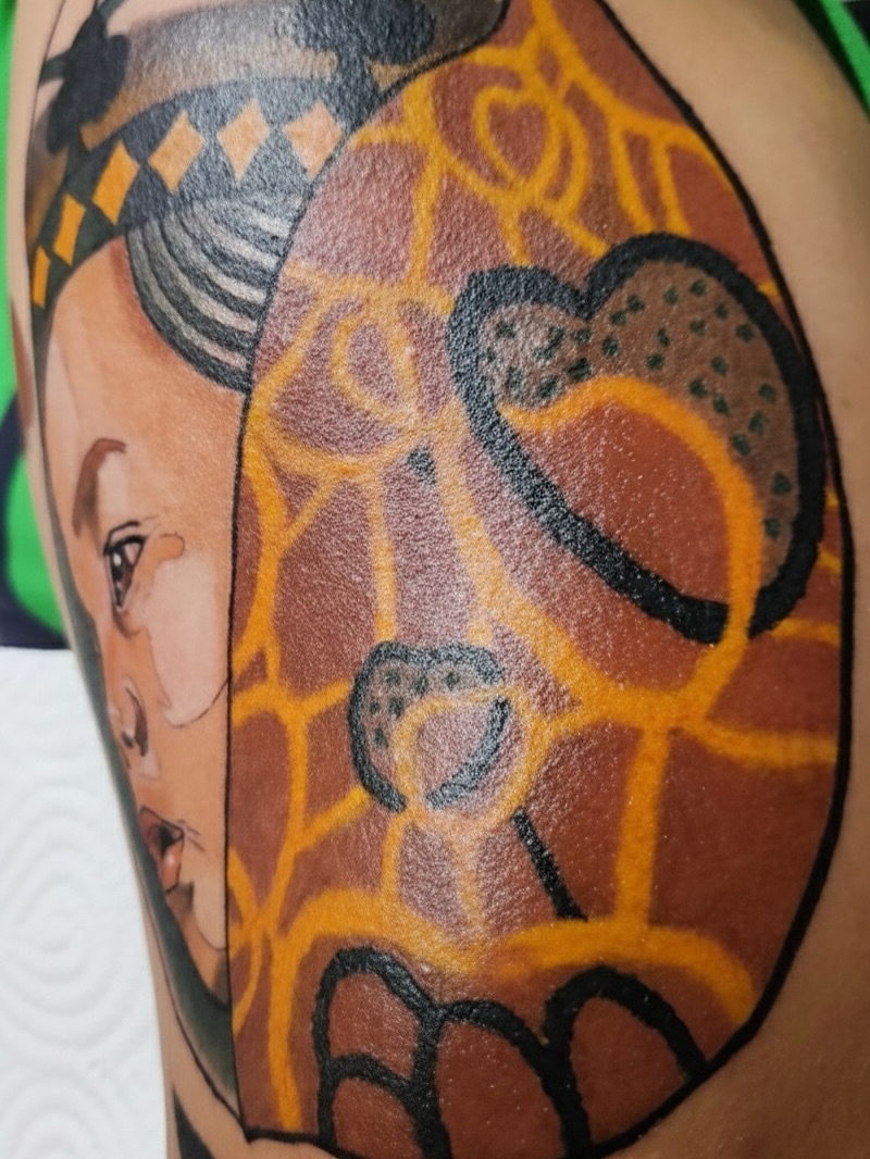 Giraffe geometric tattoo on the upper arm by Sydney Walk in Tattoo, Sydney, New South Wales