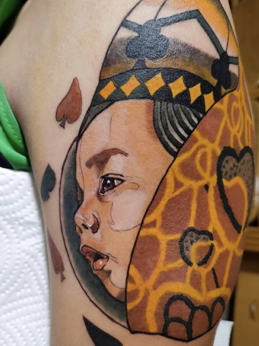 Child's face American traditional tattoo on the forearm by Sydney Walk in Tattoo, Sydney, New South Wales