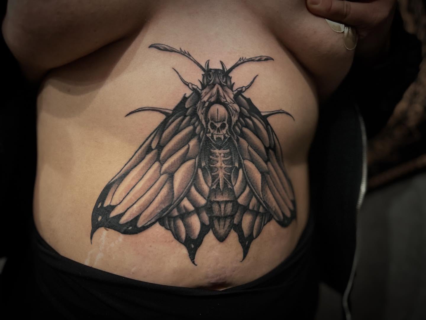 Moth realism tattoo on the torso by Brian Keith