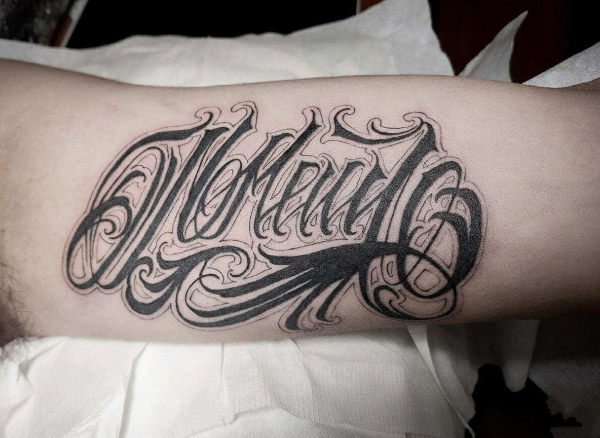 Script lettering lettering script tattoo on the forearm by Sydney Walk in Tattoo, Sydney, New South Wales