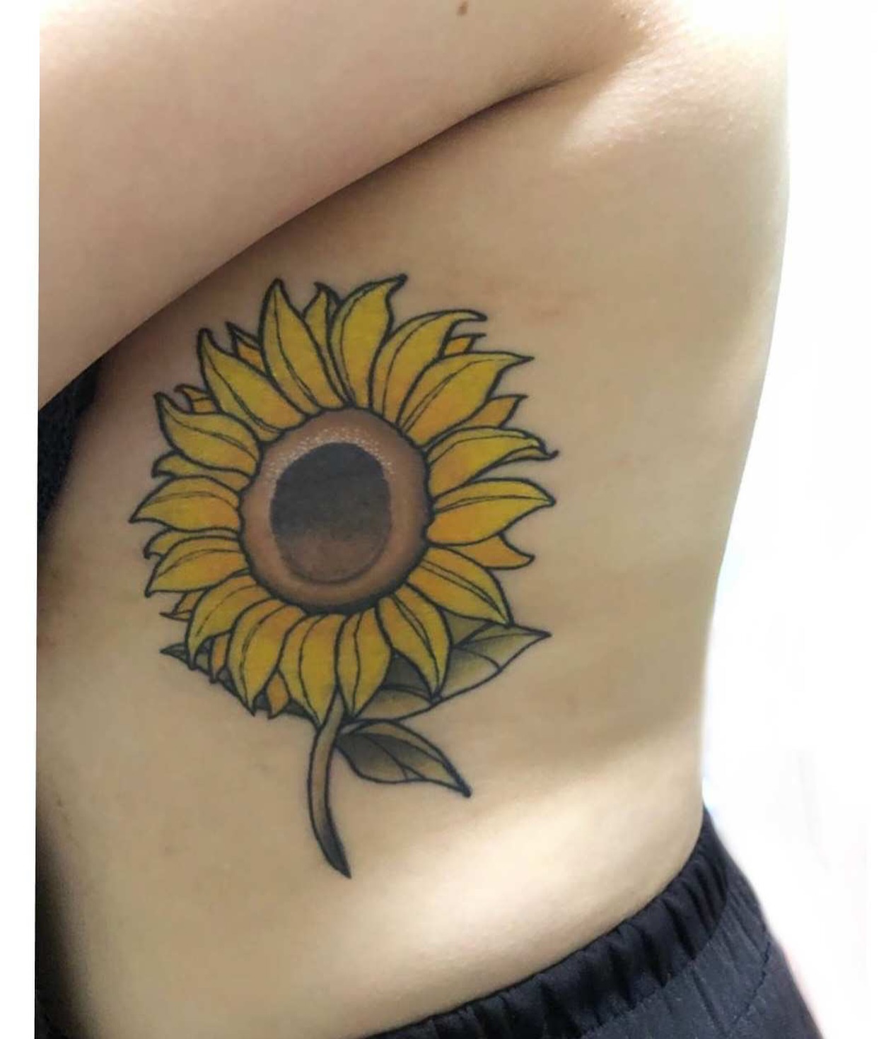 Sunflower realism tattoo on the ribs by Sydney Walk in Tattoo, Sydney, New South Wales