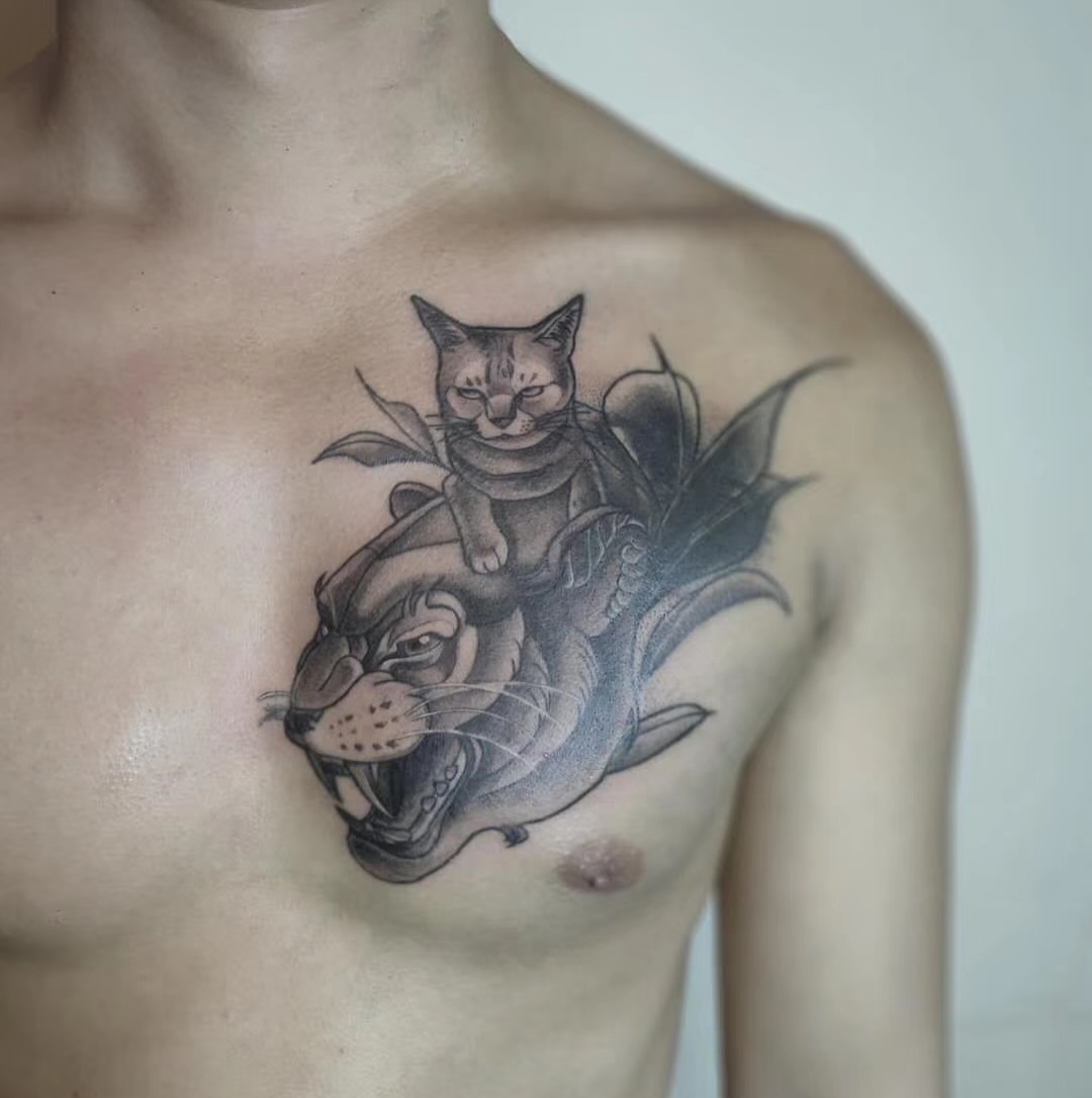 Cat riding tiger black and grey tattoo on the chest by Sydney Walk in Tattoo, Sydney, New South Wales