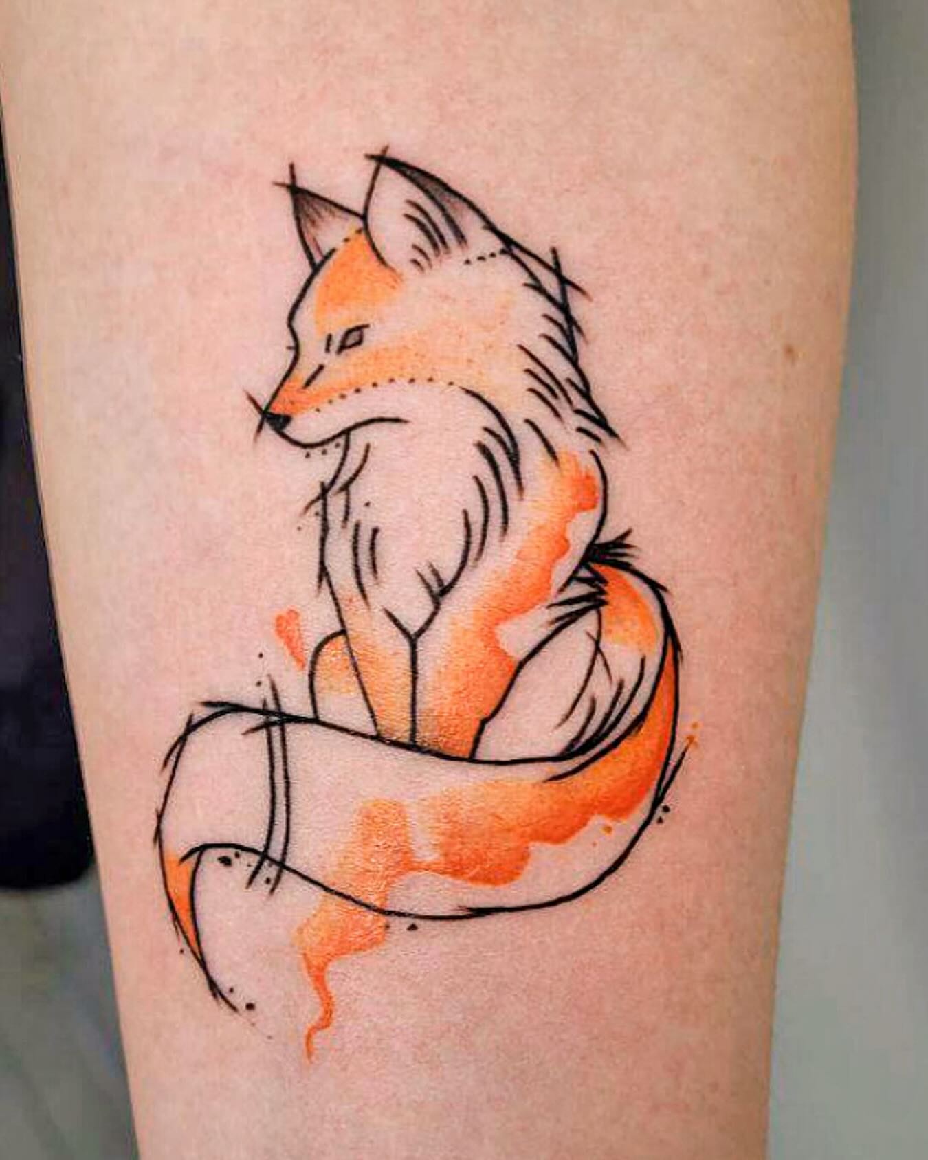 Fox watercolor tattoo on the forearm by Артем Летний