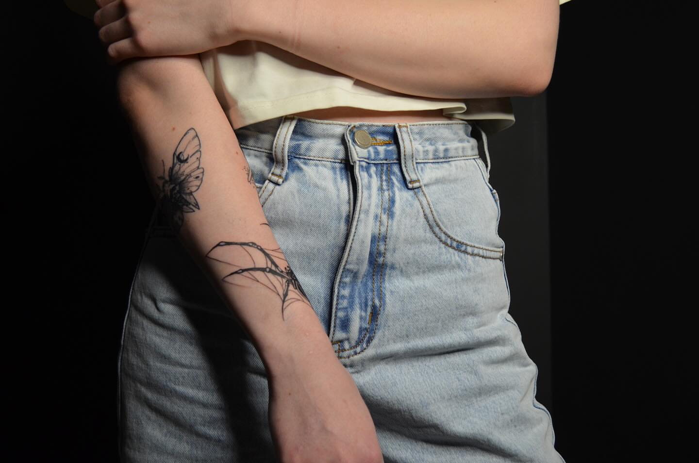 Moth and branch black and grey tattoo on the forearm by Артем Летний