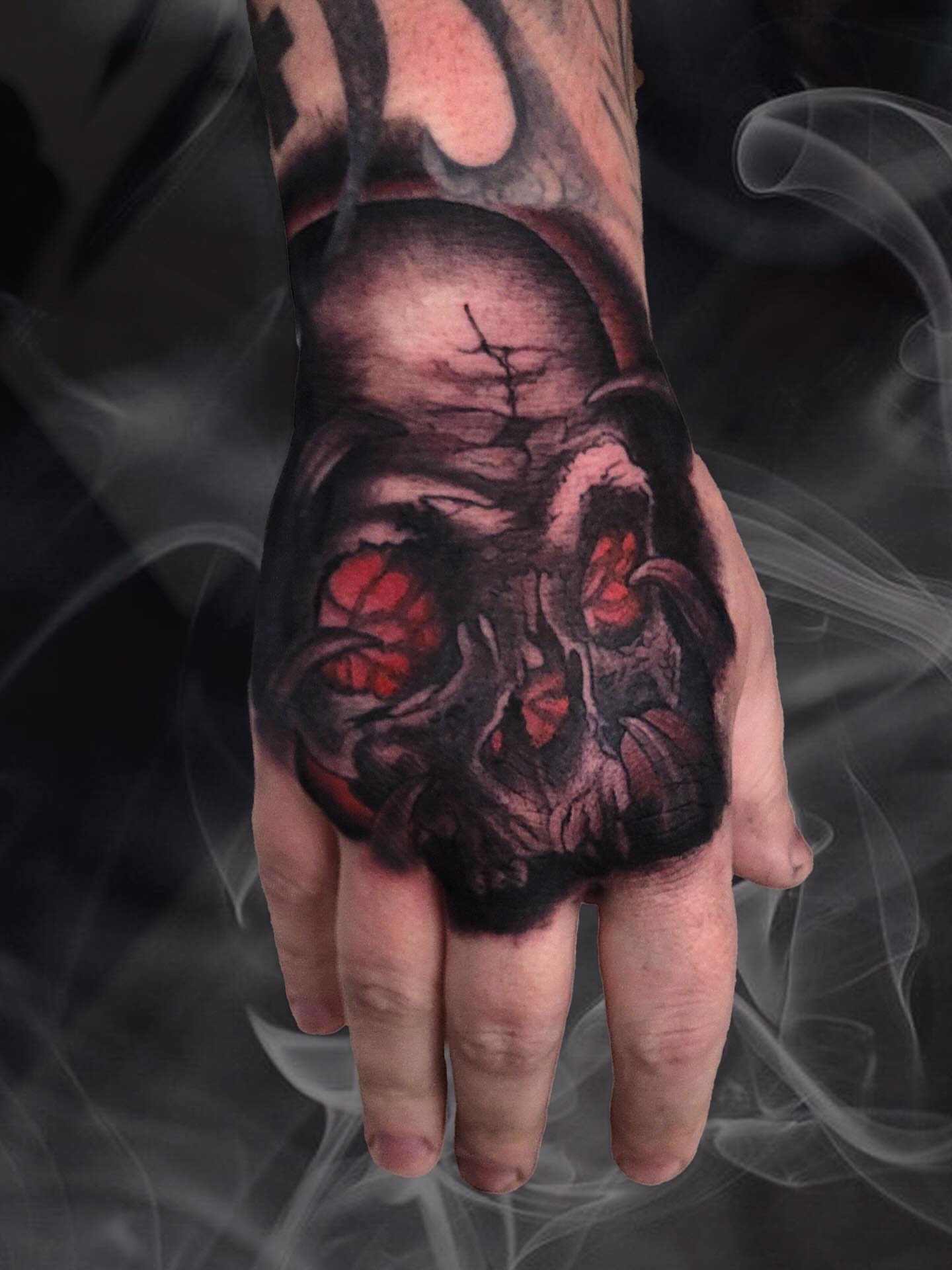 Skull with roses dark realism tattoo on the hand by Артем Летний