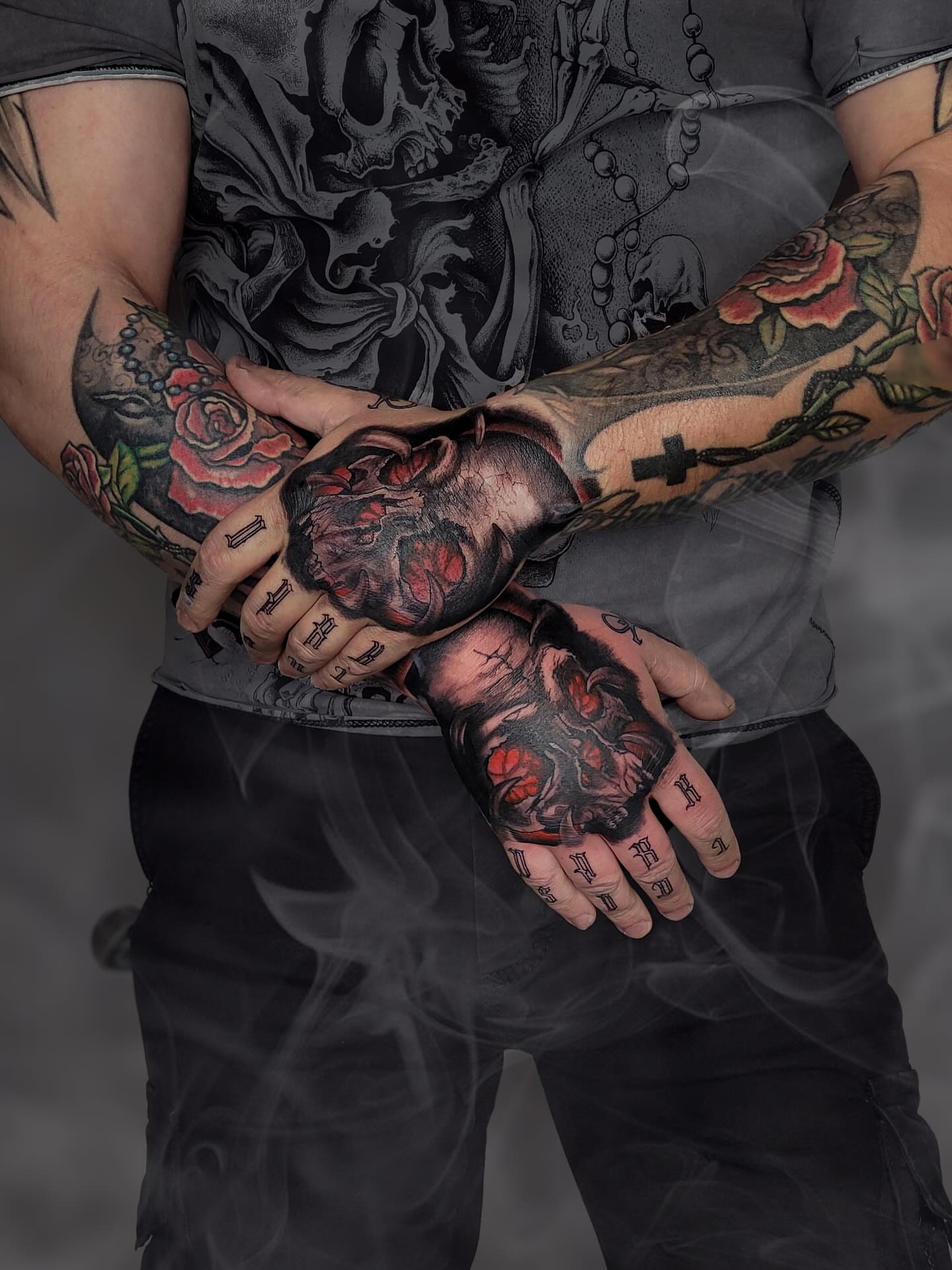 Skulls and roses American traditional tattoo on the forearm by Артем Летний
