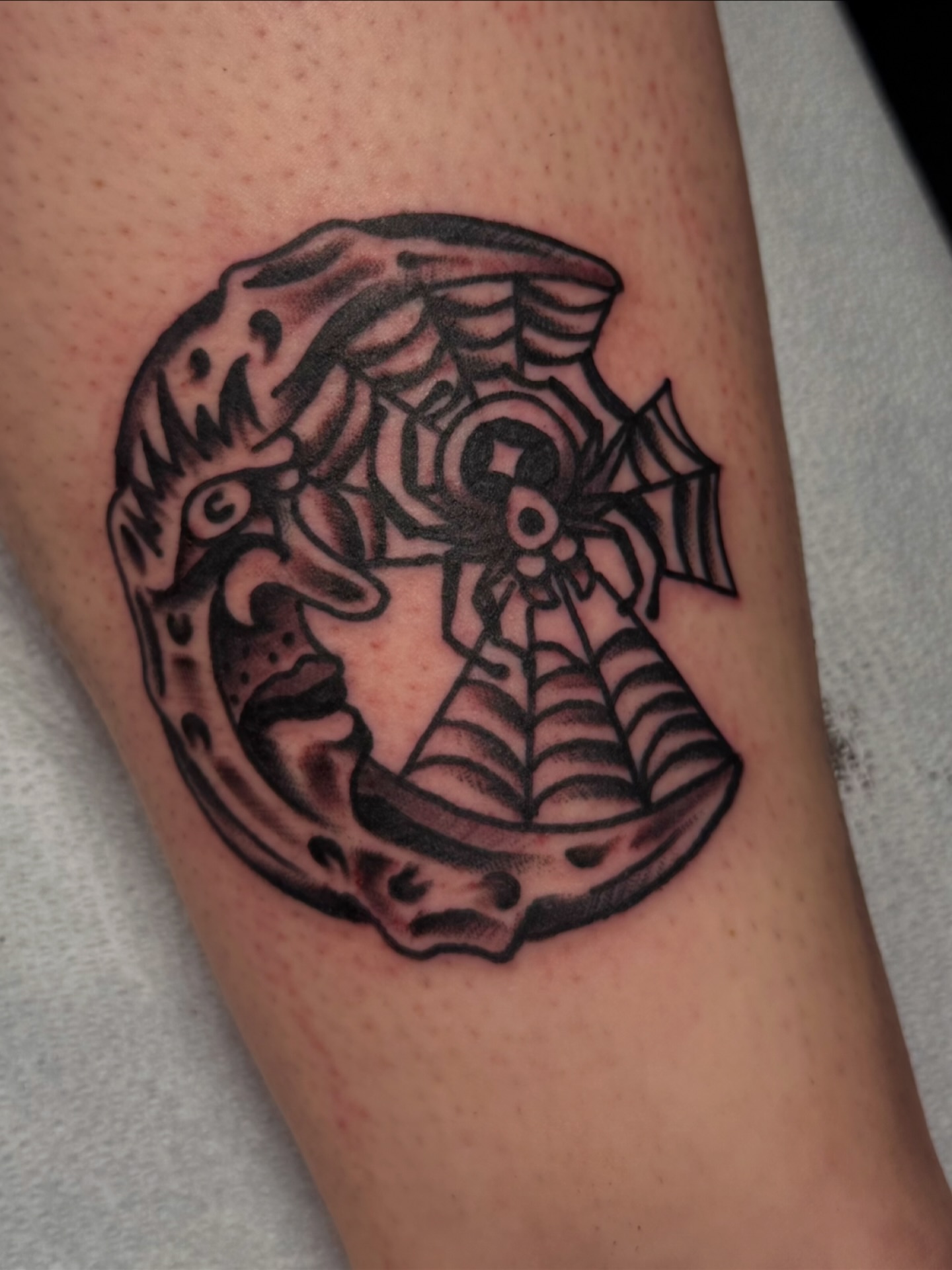 Anchor with spiderweb black and grey tattoo on the forearm by Zac Clark