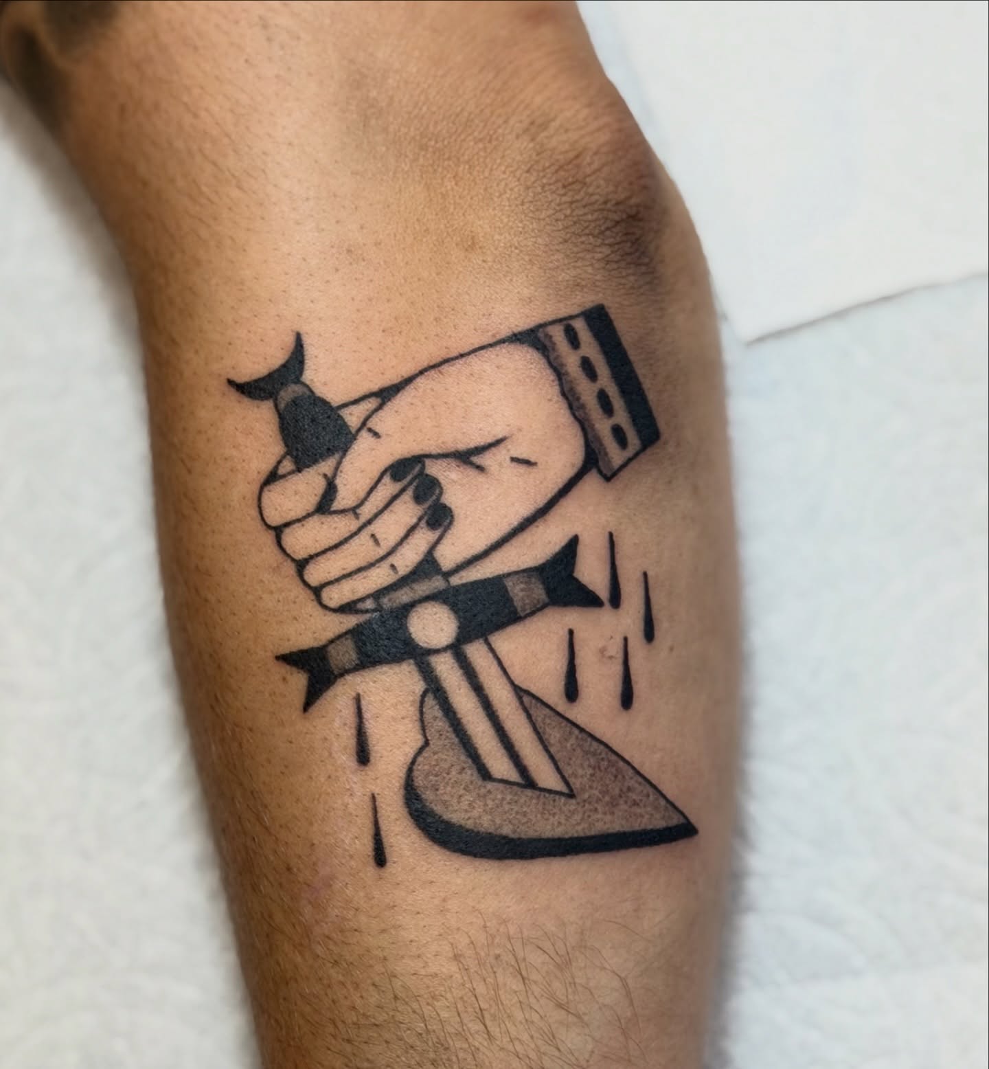 Iron and hammer black and grey tattoo on the forearm by Maks