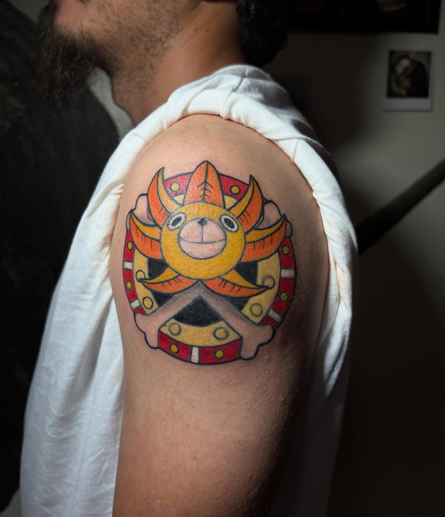 Sun and mask American traditional tattoo on the shoulder by Shampooh