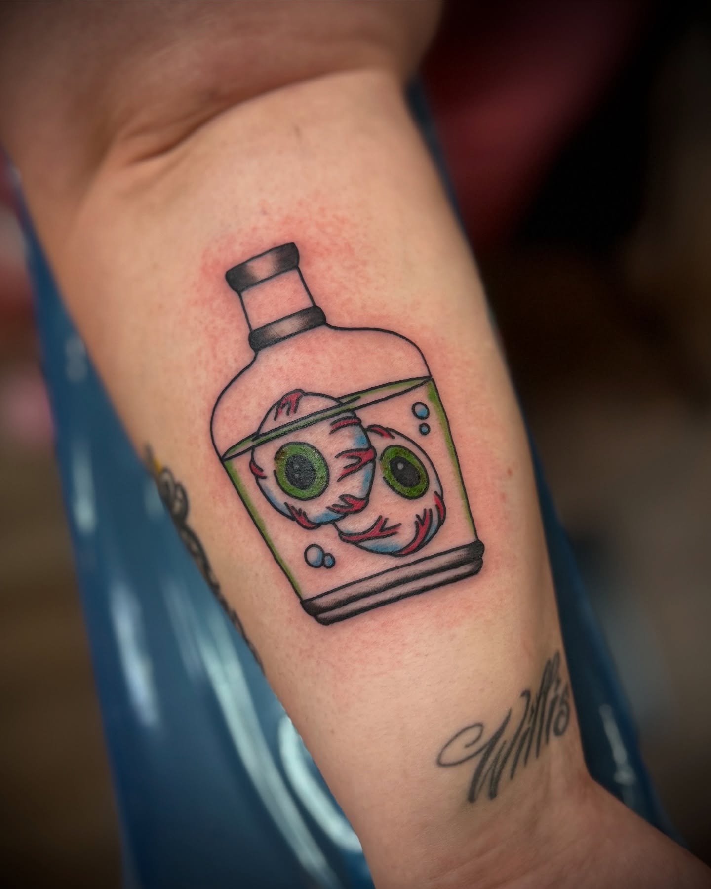 Monster in bottle dotwork tattoo on the forearm by Justin Bianchini - New Orleans Tattoo Artist