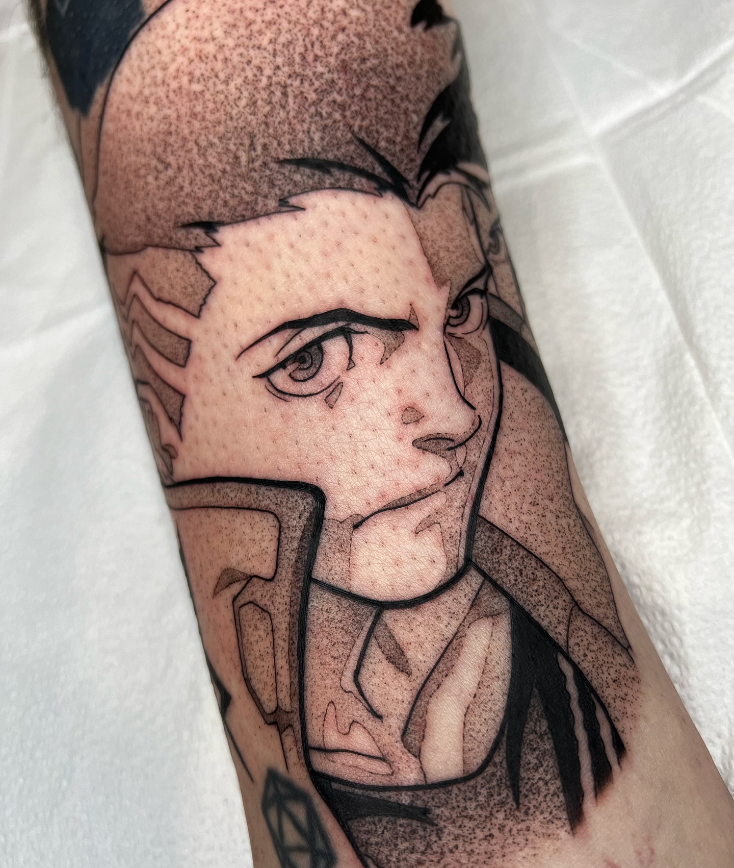 Anime character dotwork tattoo on the forearm by Z, Greenville, South Carolina