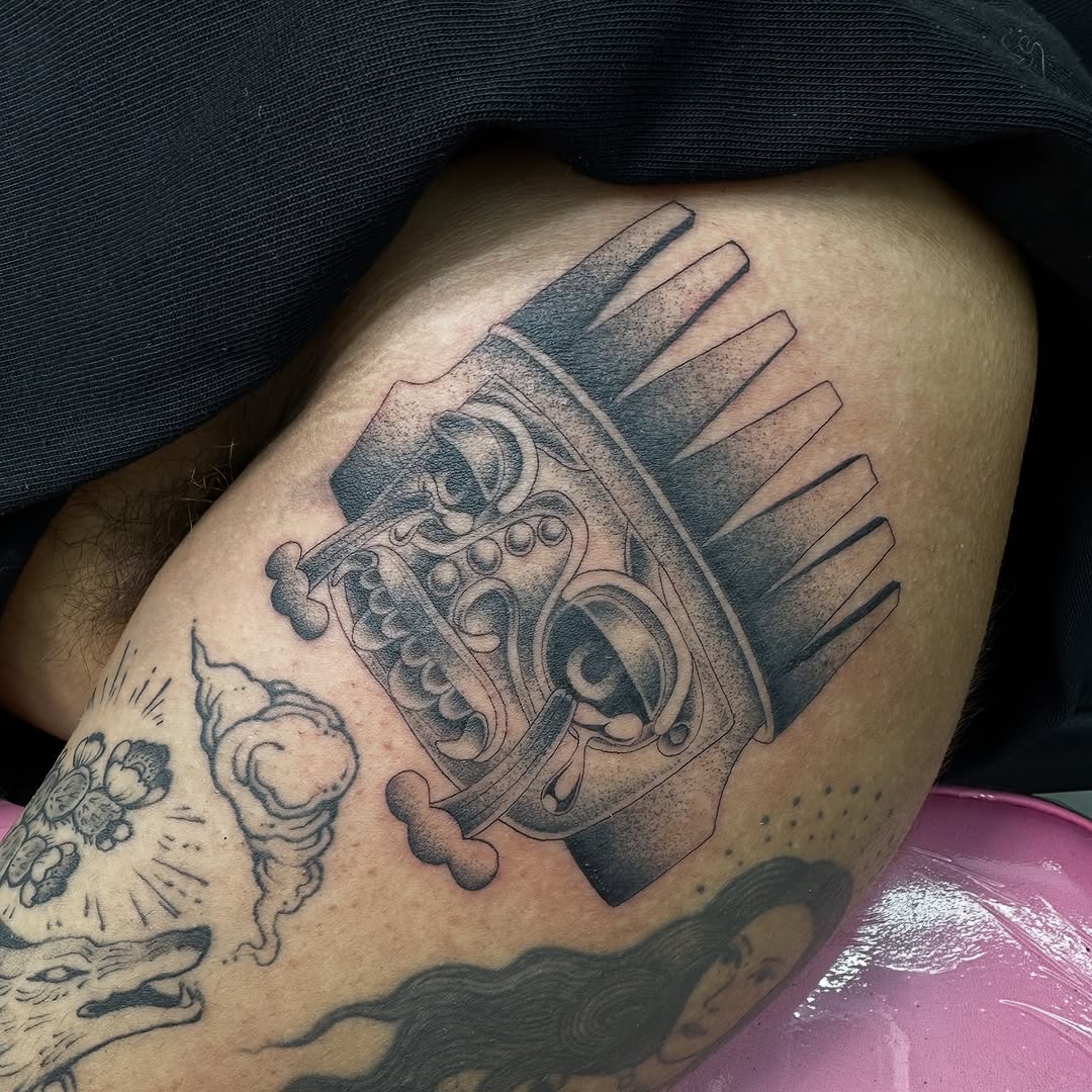 Tribal mask dark art tattoo on the thigh by christina diaz