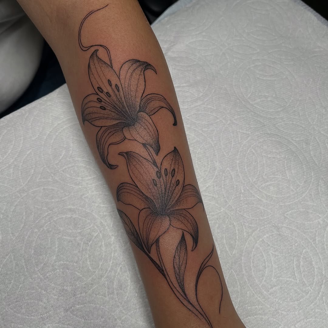 Lilies fine line tattoo on the forearm by christina diaz
