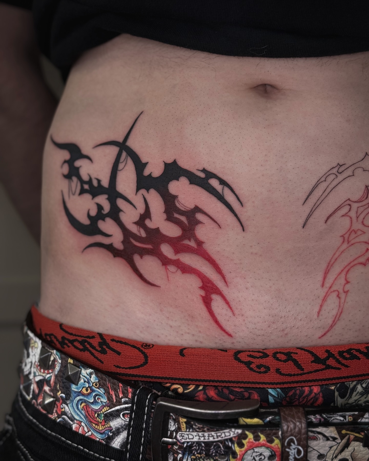 Flame tribal tattoo on the ribs by 𝕮𝖞𝖇𝖊𝖗𝕾𝖎𝖌𝖎𝖑𝖎𝖘𝖒