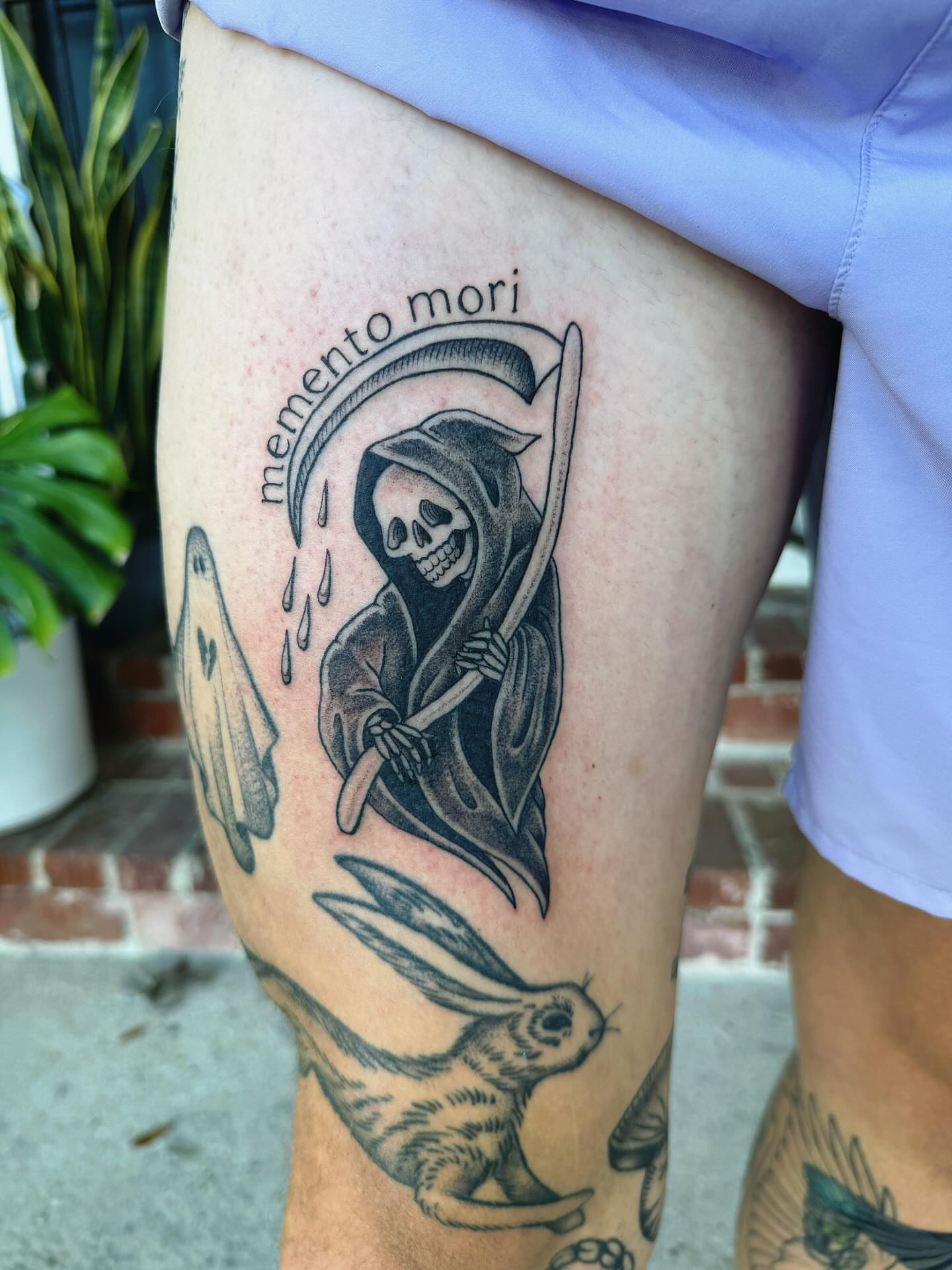 Reaper and rabbit black and grey tattoo on the thigh by π½πππππ π½πππππππ, New Orleans, Louisiana