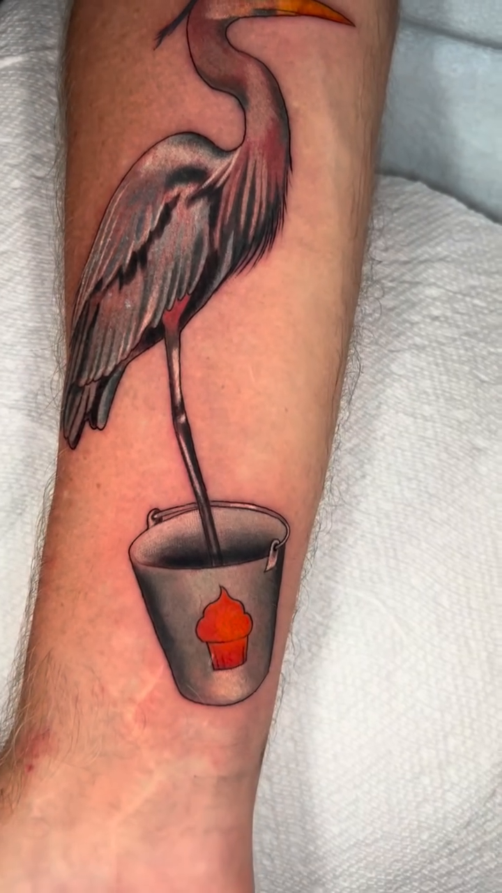Great blue heron with a bucket realism tattoo by High Vibrations