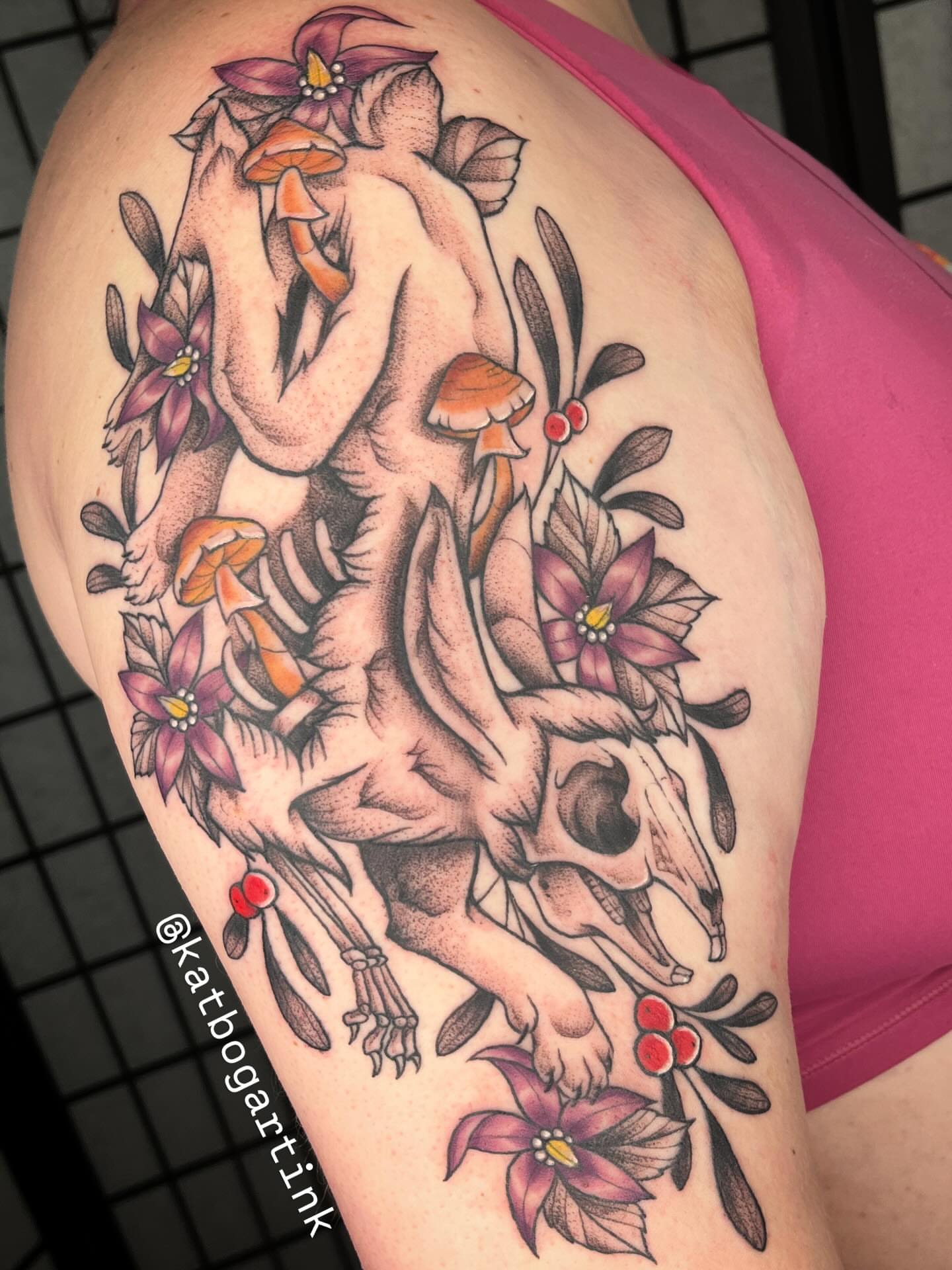 Deer skull and flowers American traditional tattoo on the thigh by Kat (Scout) Bogart