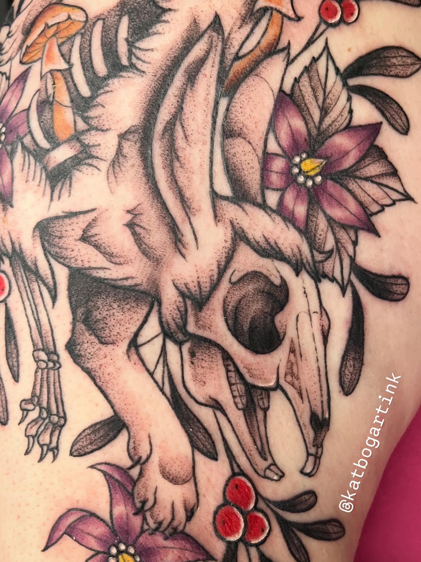 Deer skull and flowers American traditional tattoo on the shoulder by Kat (Scout) Bogart