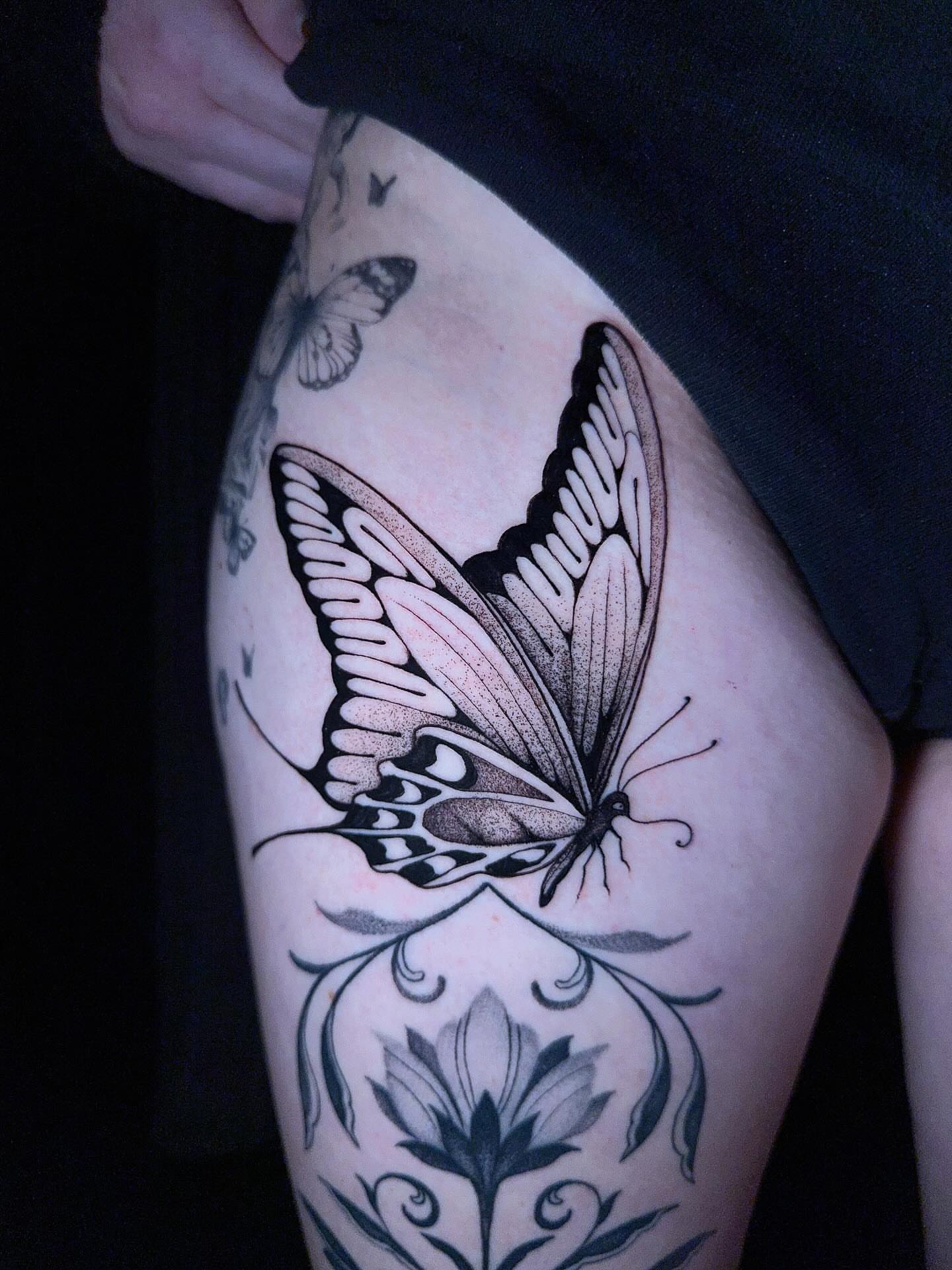 Butterfly dotwork tattoo on the thigh by Amber