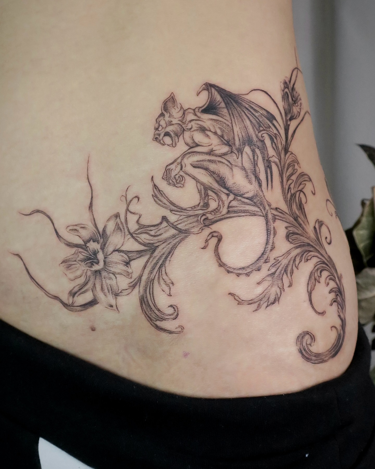 Gargoyle and flowers ornamental tattoo by Olivia