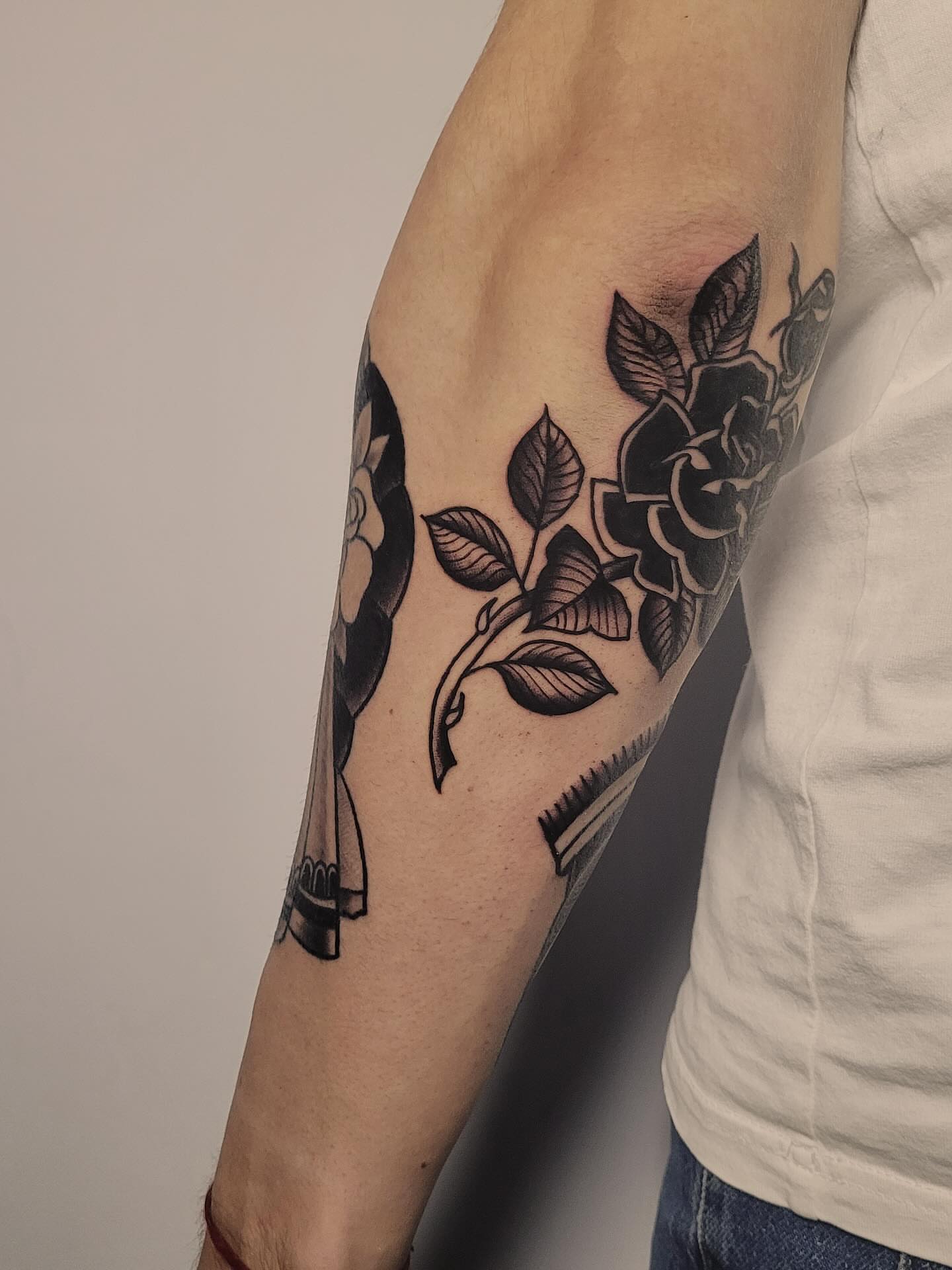 Floral design black and grey tattoo on the forearm by Артем Летний