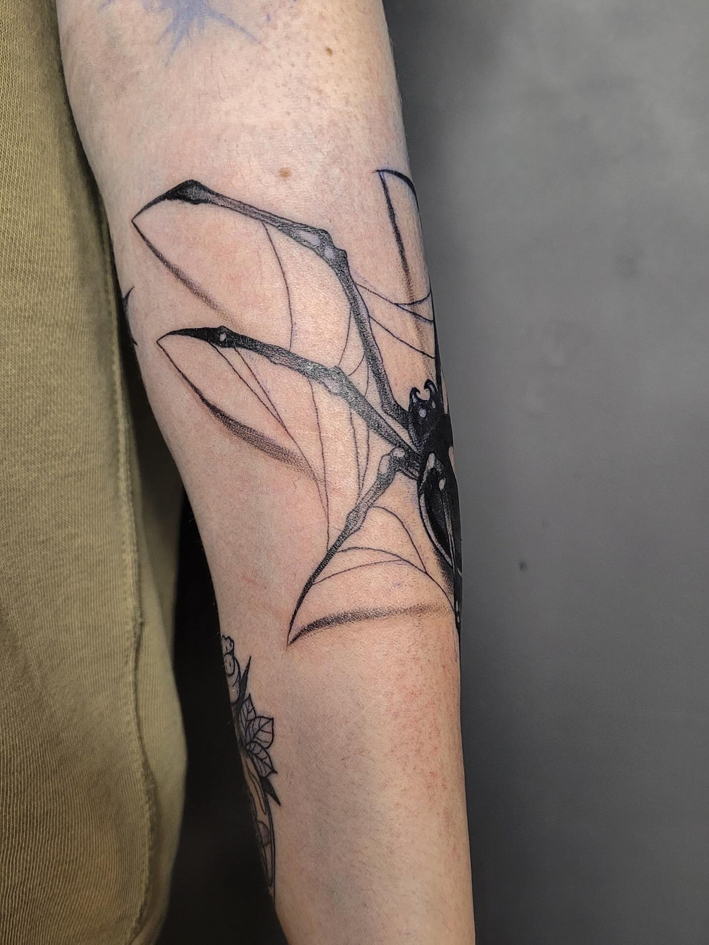 Dragonfly black and grey tattoo on the forearm by Артем Летний