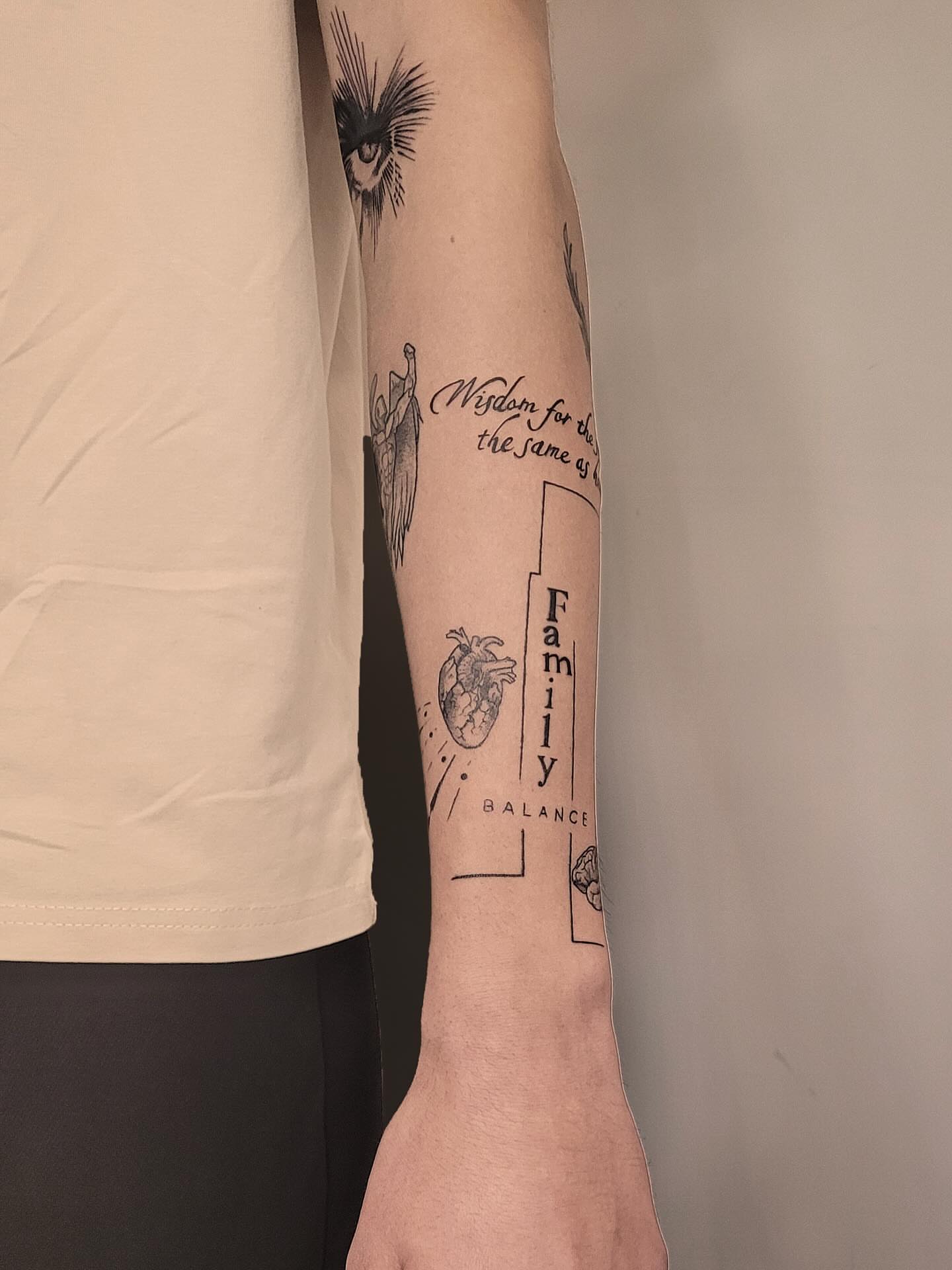 Heart with wings black and grey tattoo on the forearm by Артем Летний