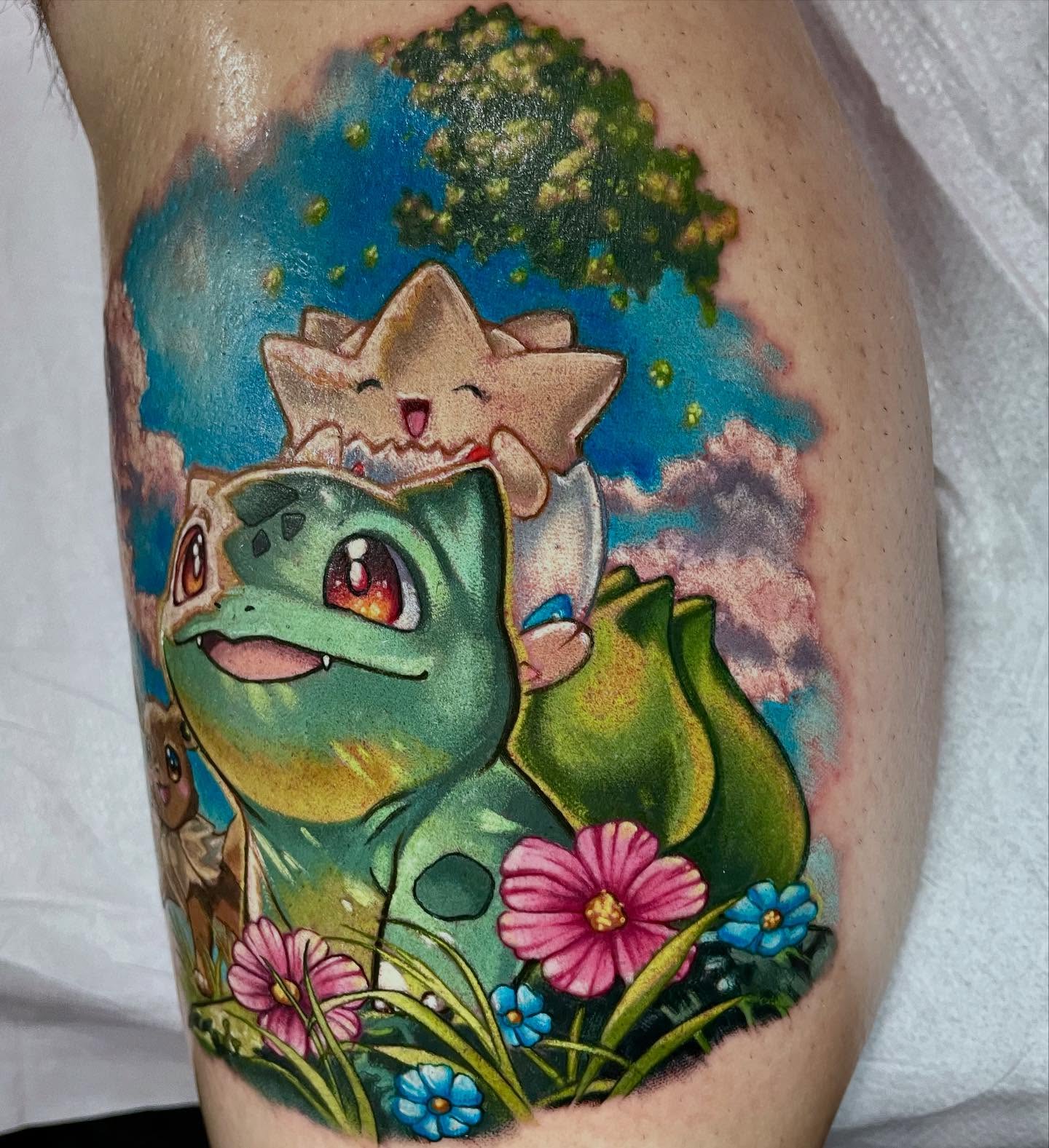 Bulbasaur and starfl new school tattoo on the thigh by Shana 🍊Orlando,Fl