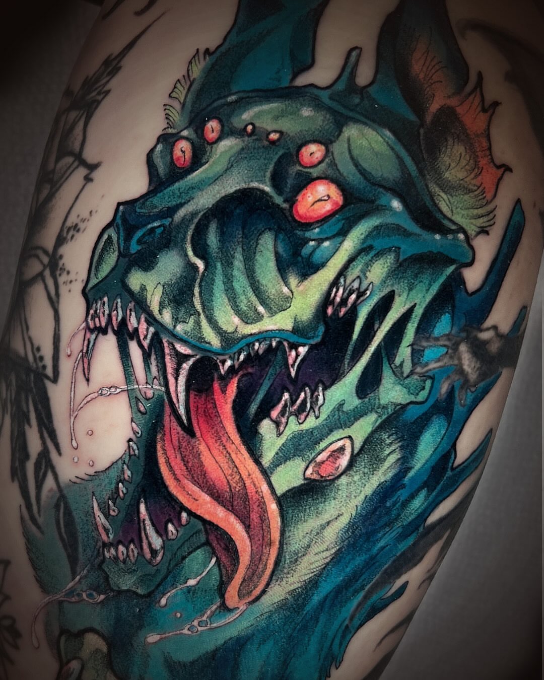 Monster dark realism tattoo on the forearm by Kate Erso