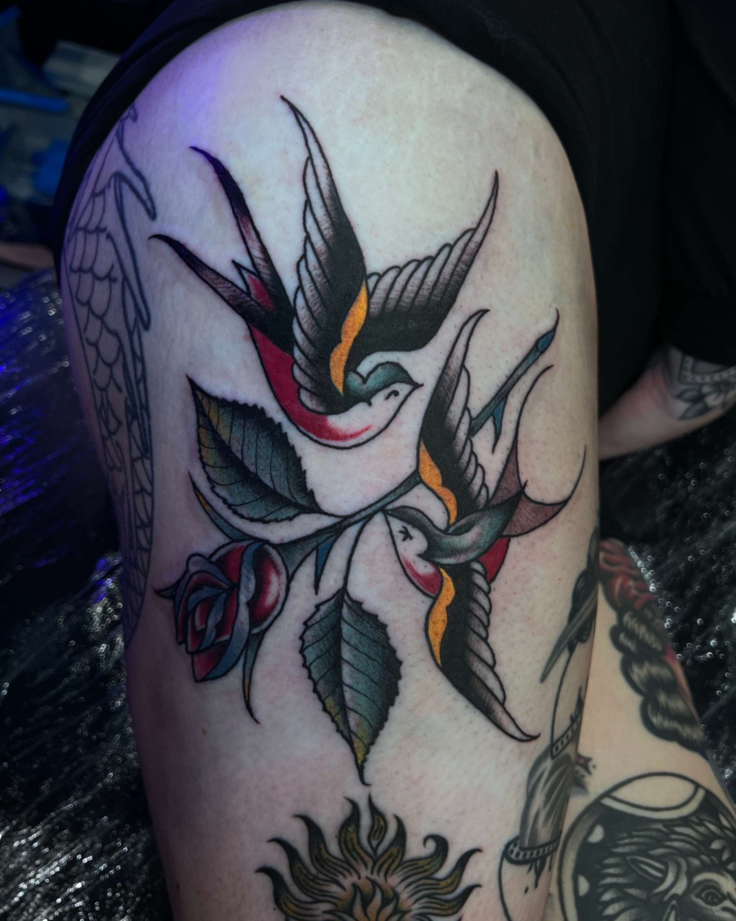 Swallow and roses American traditional tattoo on the thigh by Alessandro Pennella