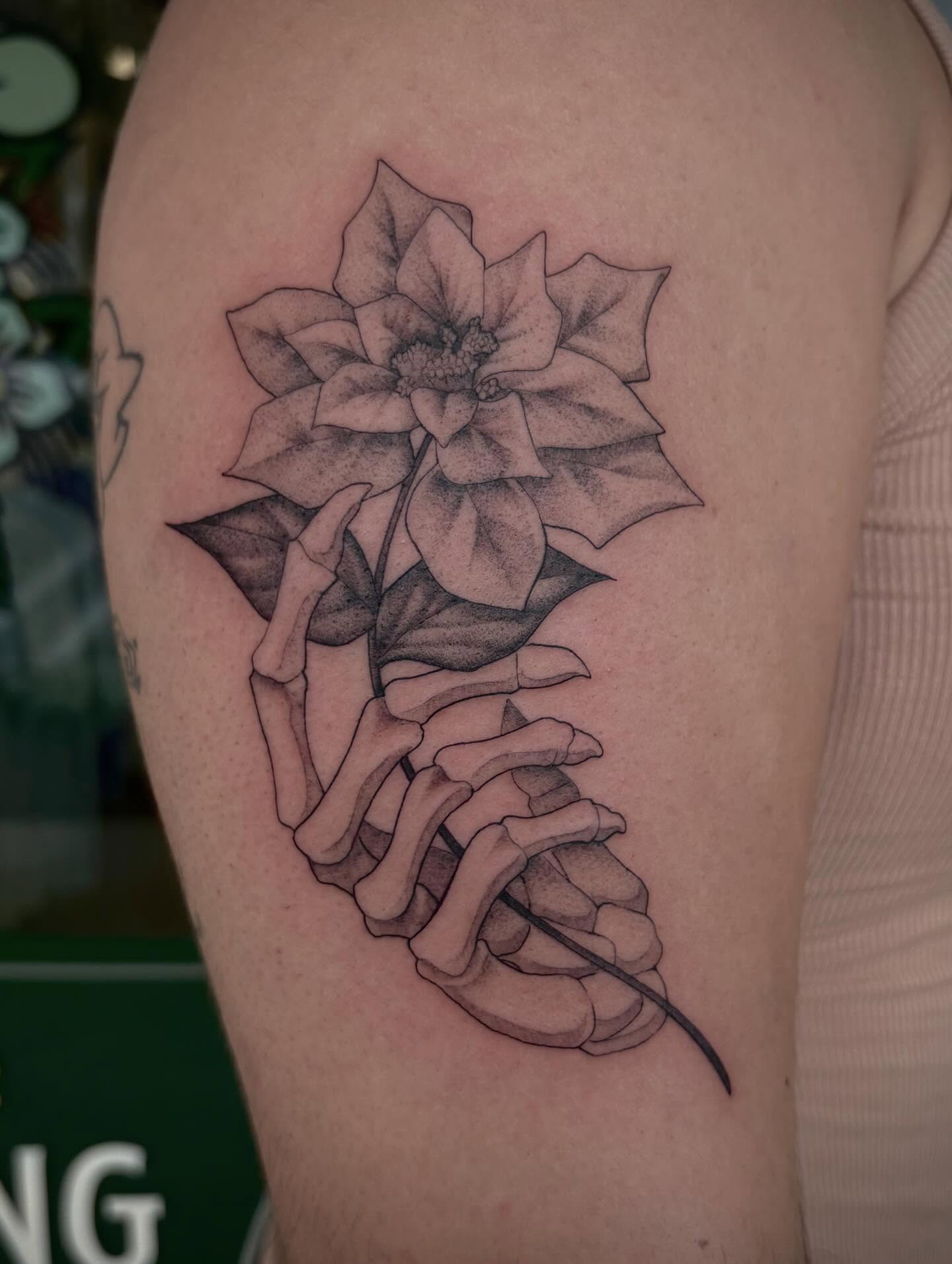 Flower and skeleton dotwork tattoo on the upper arm by Miami Tattoo Artist π Mel Carrasco