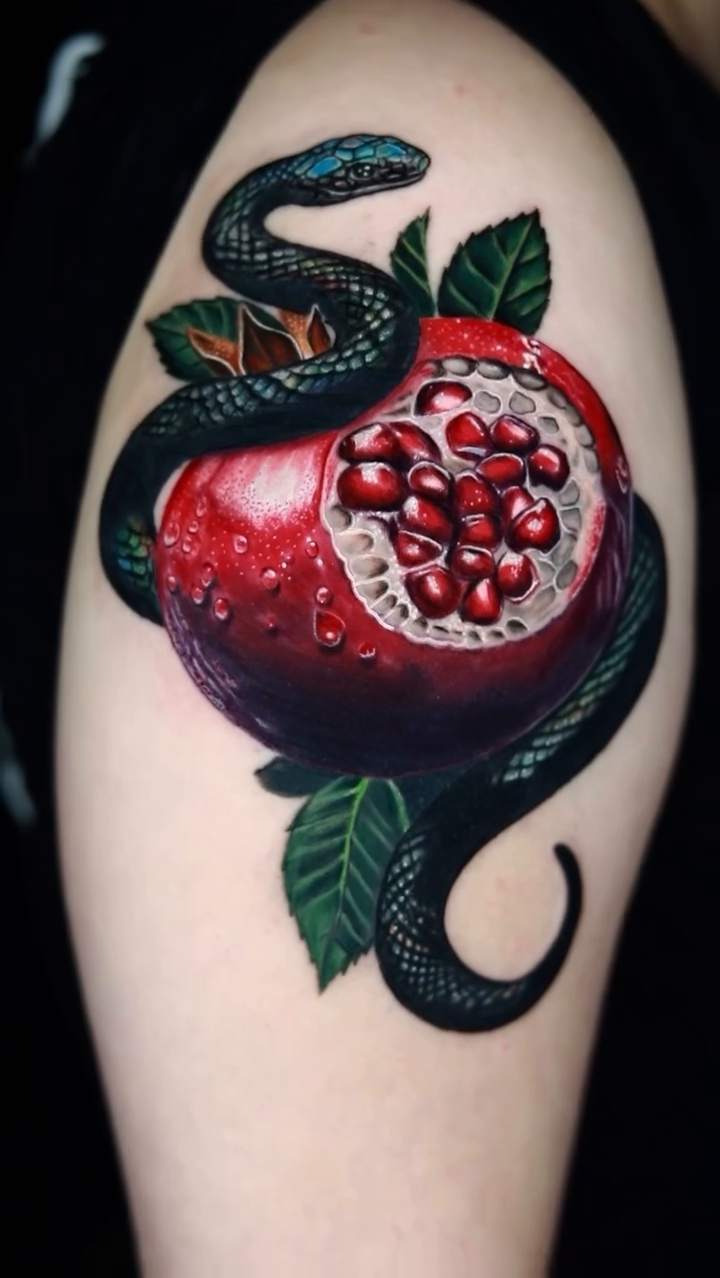 Snake and pomegranate realism tattoo by Jules, Arlington, Texas