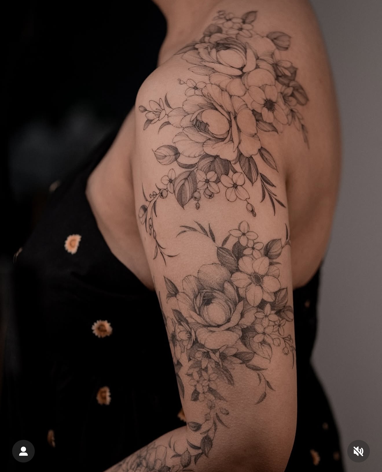 Floral bouquet black and grey tattoo on the upper arm by Mary Shekh