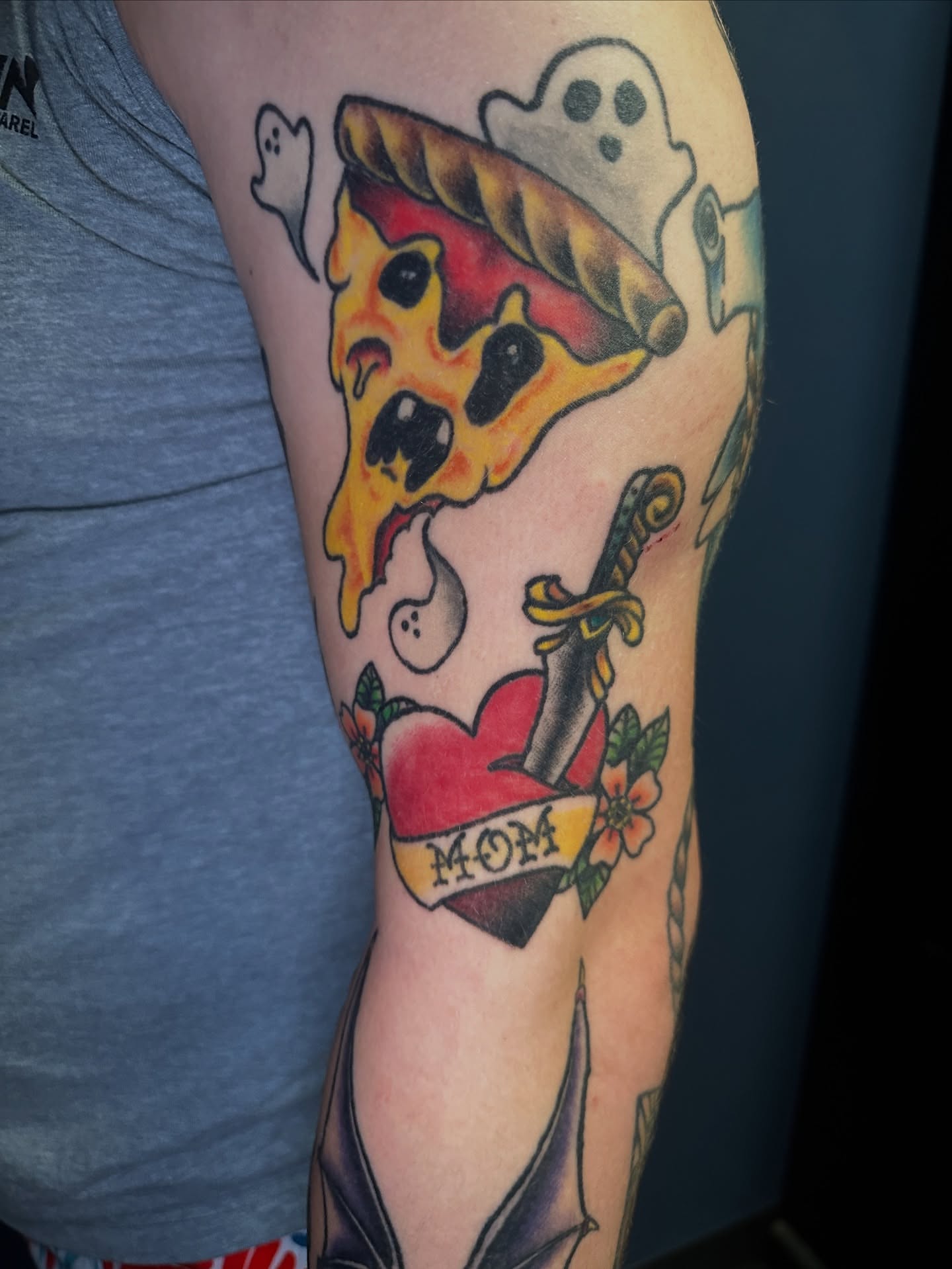 Pizza slice American traditional tattoo on the forearm by Maggie De La Torre ๐ณ๏ธโโง๏ธ๐ฒ๐ฝ