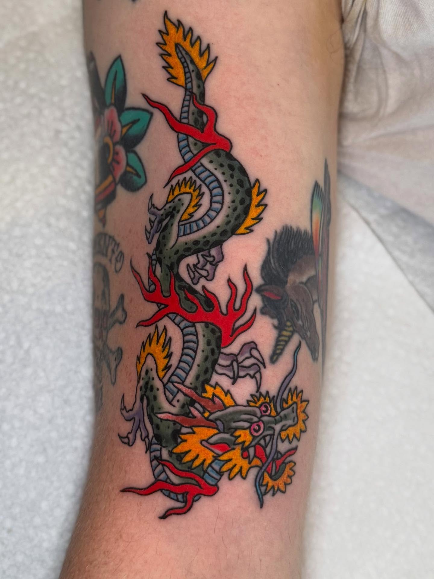 Dragon American traditional tattoo on the forearm by Seth Walker