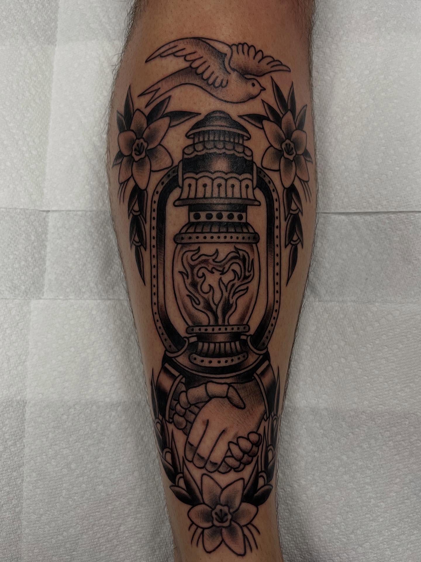 Lamp and hands American traditional tattoo on the forearm by Brian Mcfadden