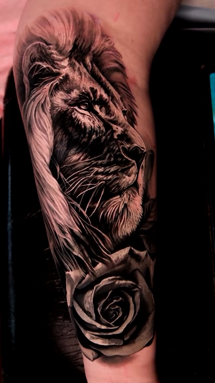 Lion and rose realism tattoo by Christopher Powell