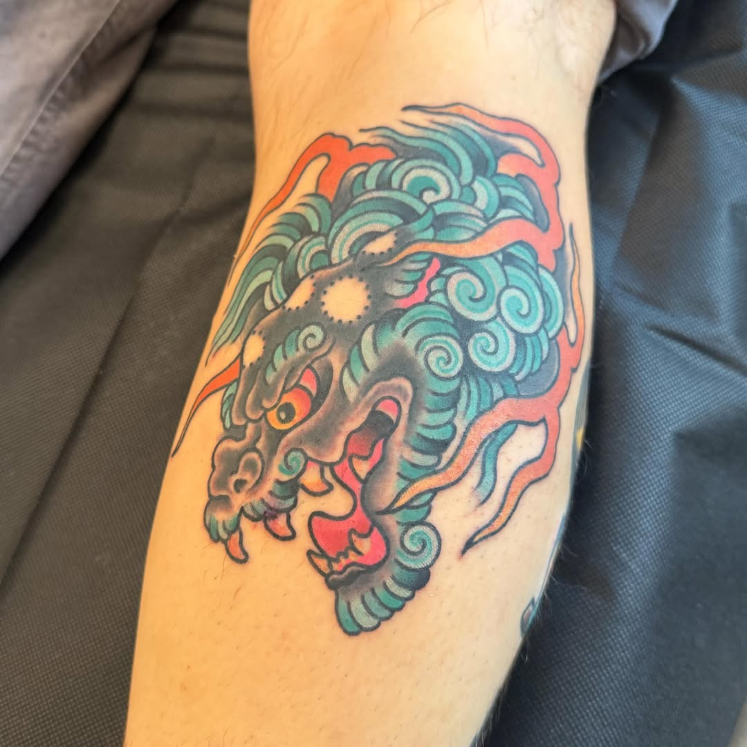 Foo dog Japanese tattoo on the forearm by Cody Dalton