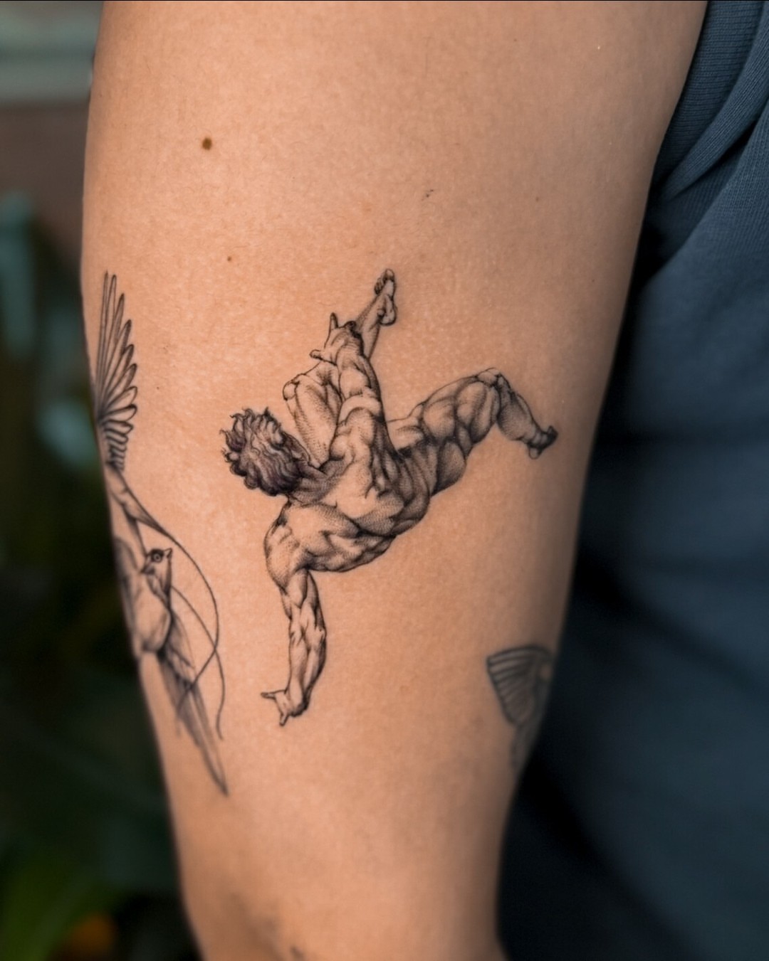 Muscular man realism tattoo on the forearm by Christian Guerrero