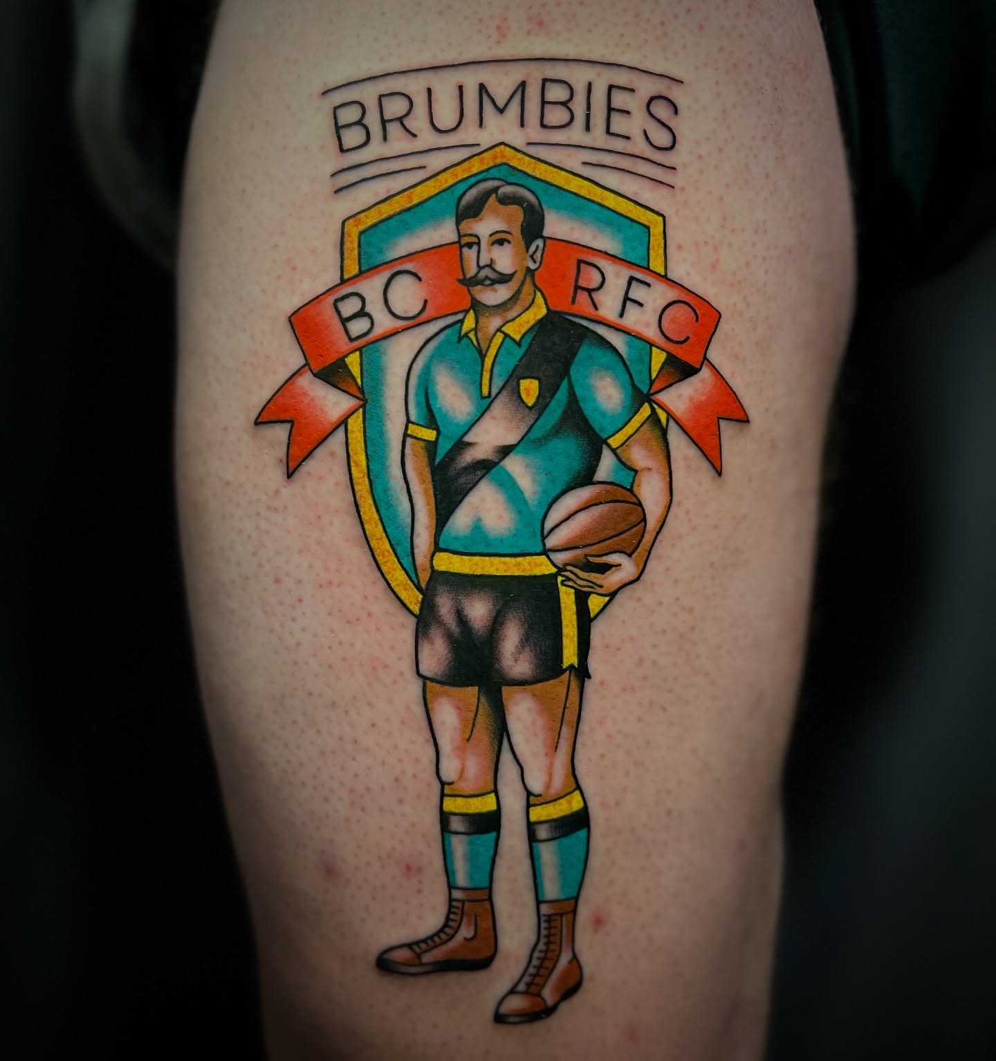 Rugby player American traditional tattoo on the thigh by Michael Munter, Philadelphia, Pennsylvania