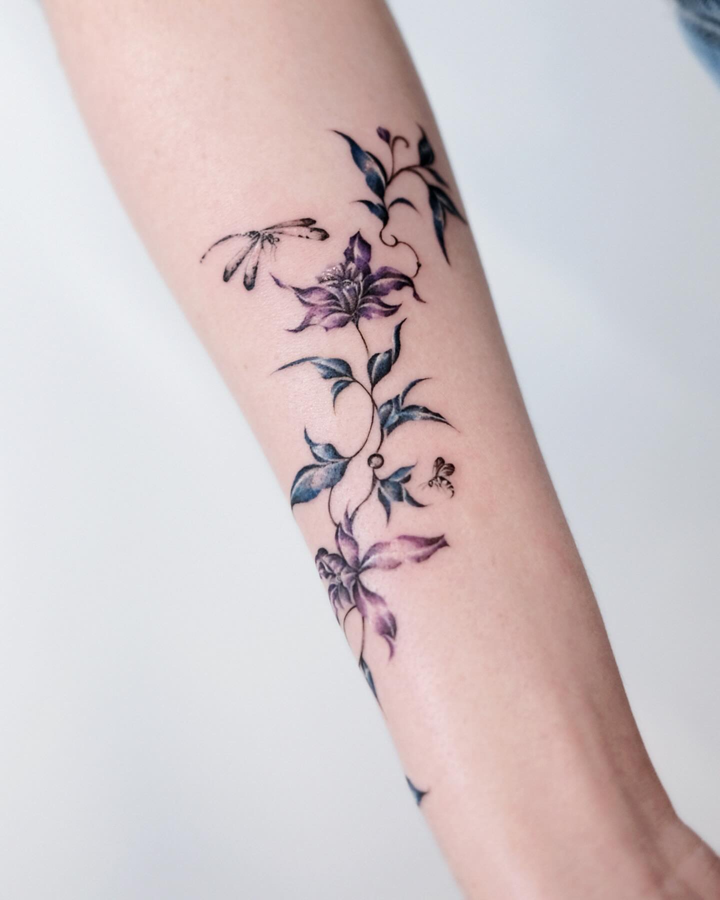 Flower vine watercolor tattoo on the forearm by 애박 ⋆⁺₊ ₊⁺⋆ Aebak