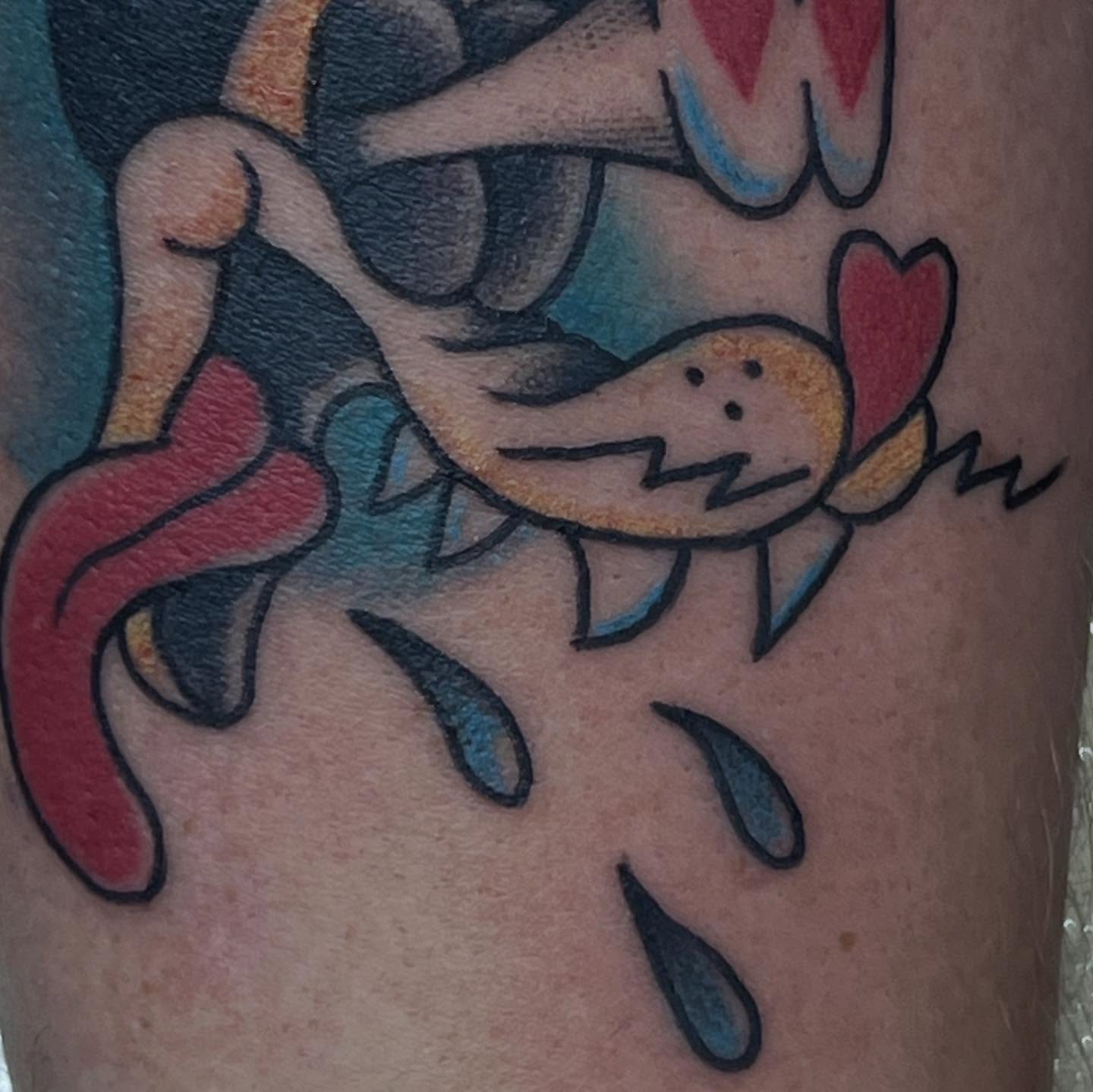 Character with heart American traditional tattoo on the forearm by Sav