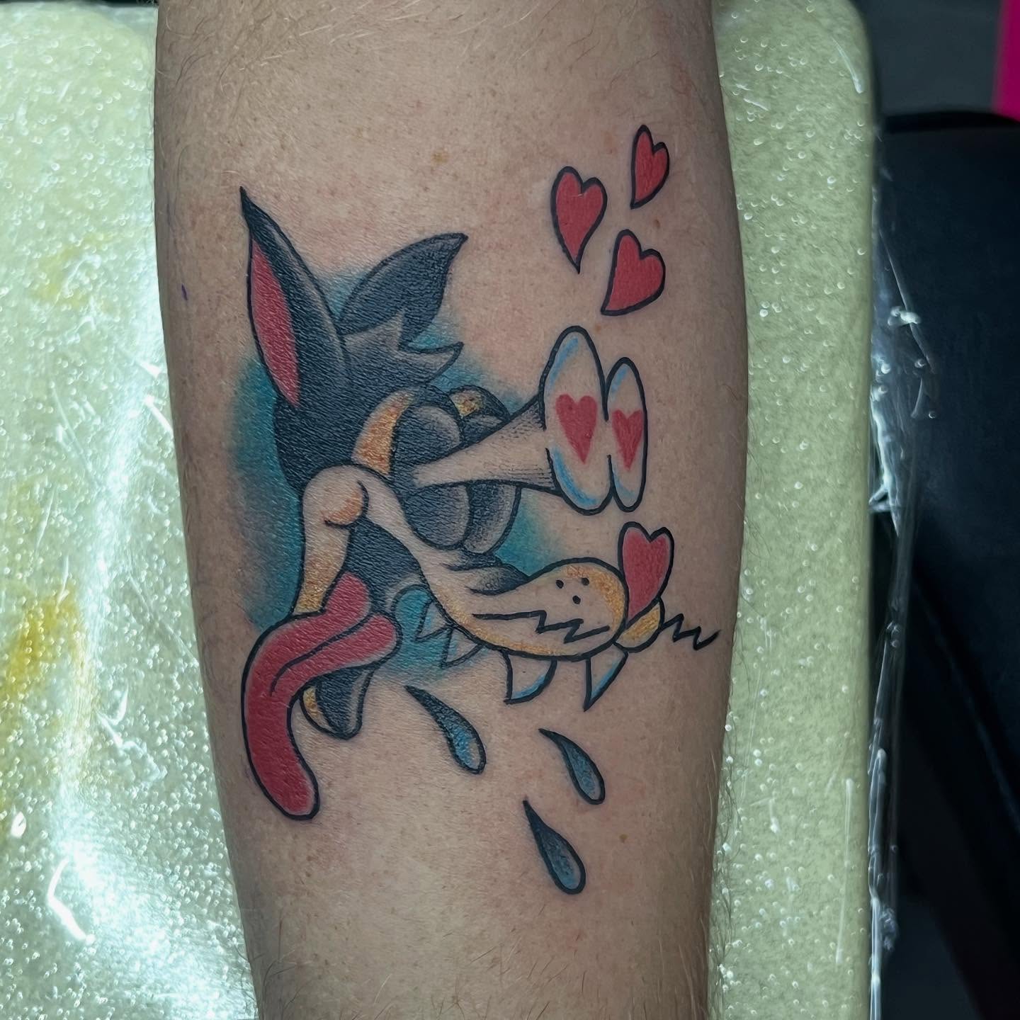 Dog with hearts dotwork tattoo on the forearm by Sav