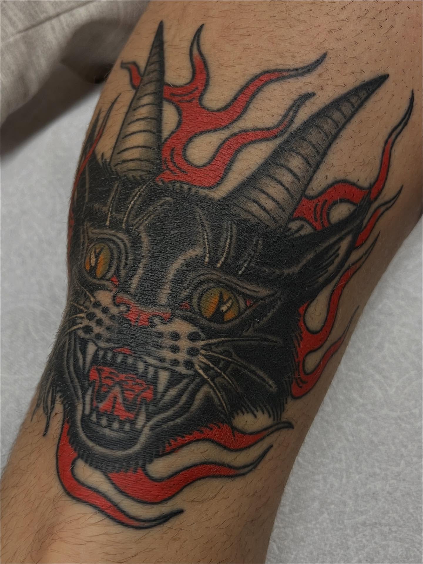 Demon head American traditional tattoo on the forearm by Kelsey Lane